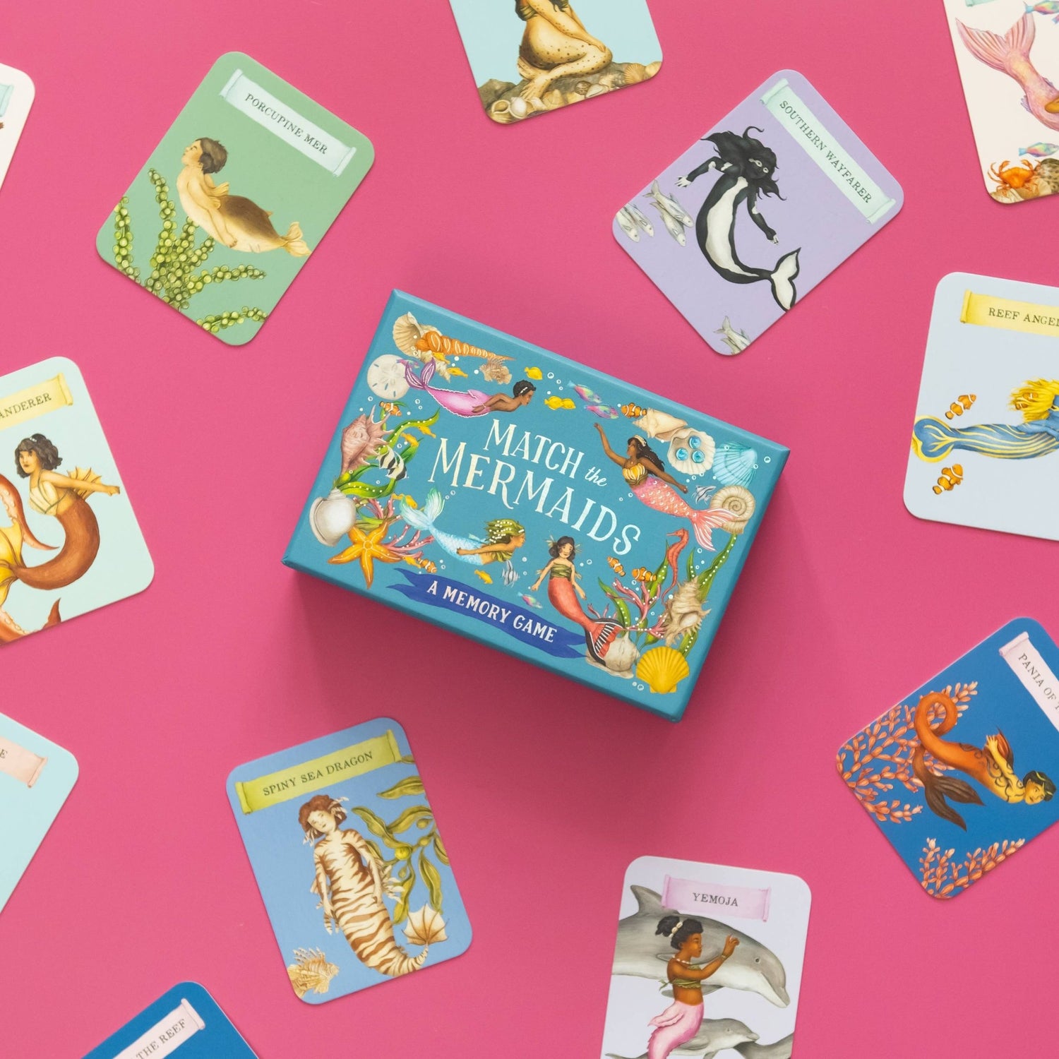 Memory game box titled 'Match the Mermaids' with cards spread out on a pink background