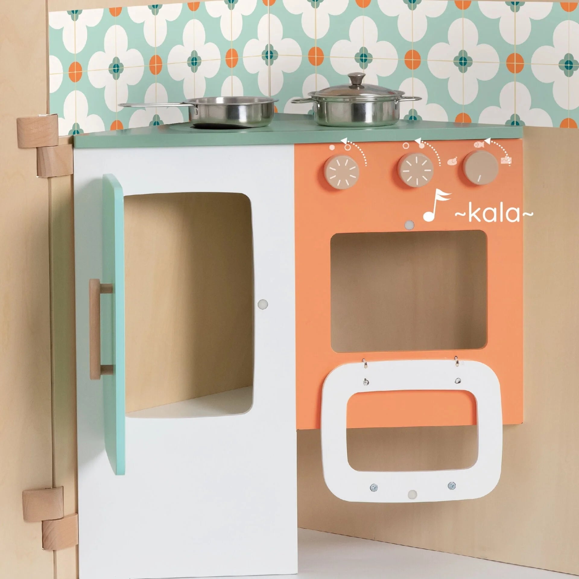Children's play kitchen set with colorful design and floral wallpaper background