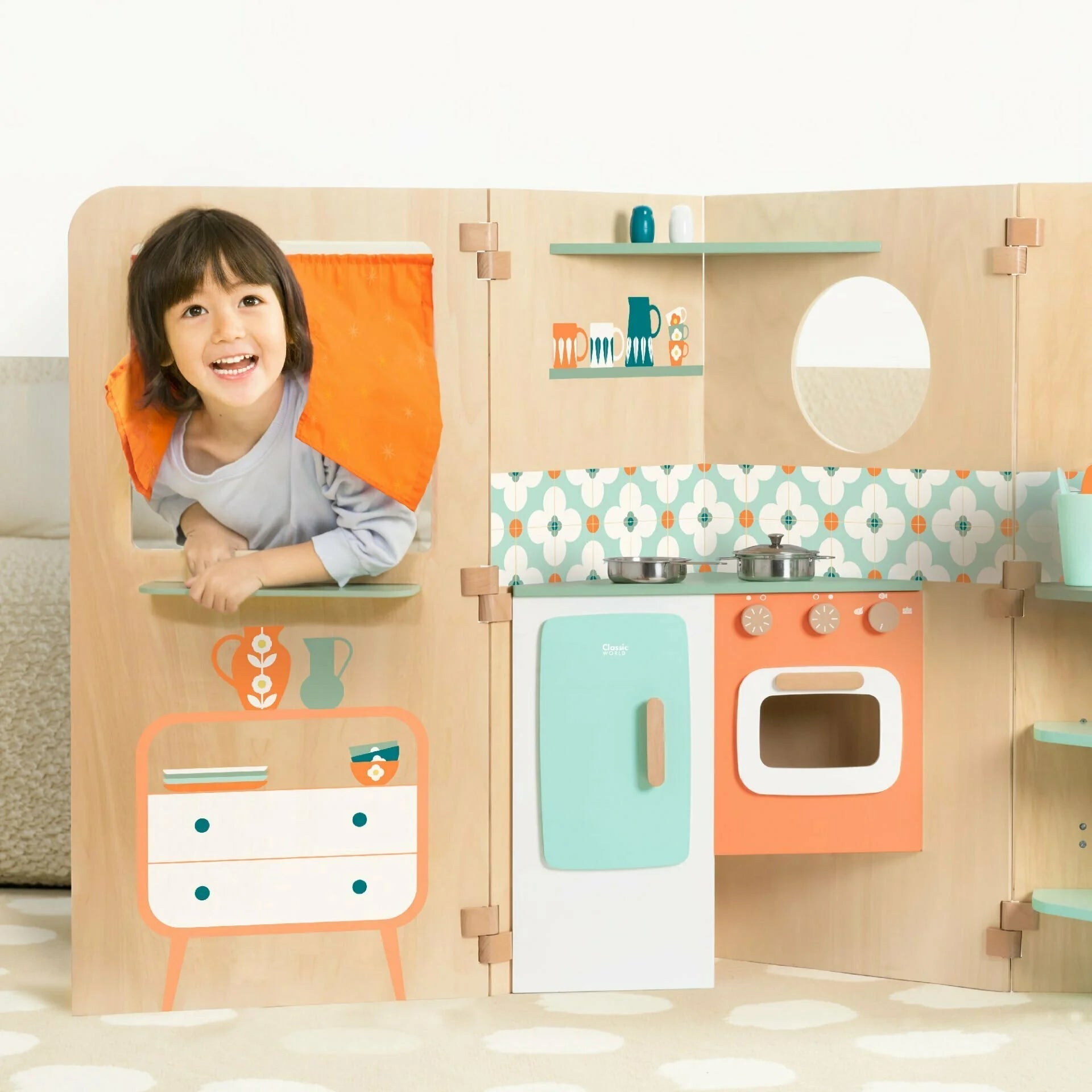 Child playing with a wooden toy kitchen set