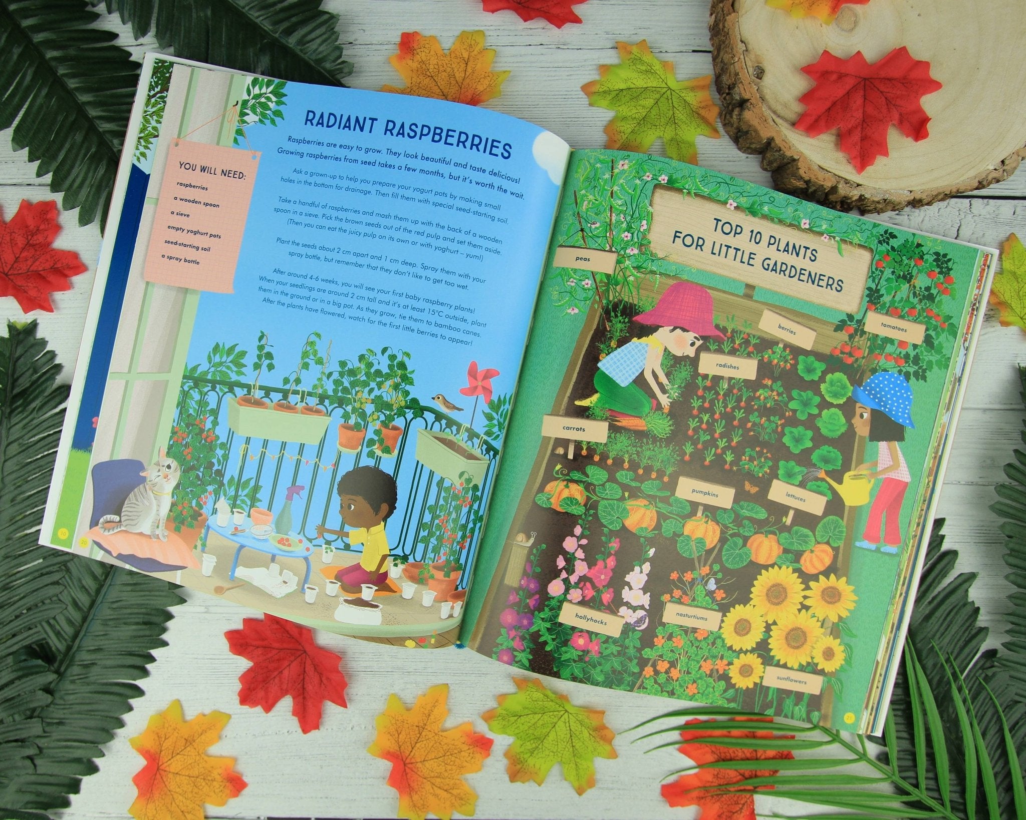 Open book with gardening-themed illustrations on a surface with leaves and a wooden log.