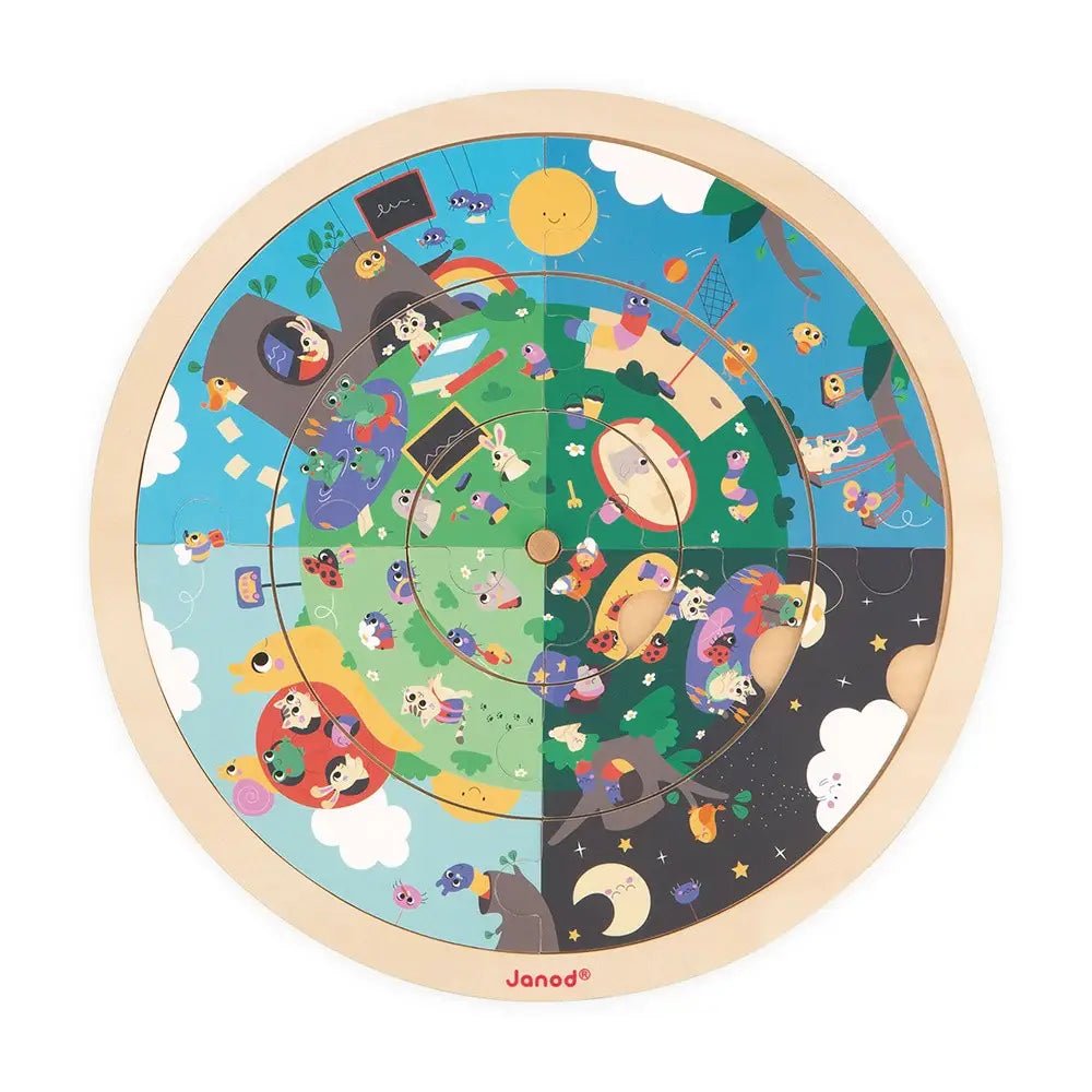 Round wooden puzzle with colorful design featuring animals and objects, branded 'Janod'.