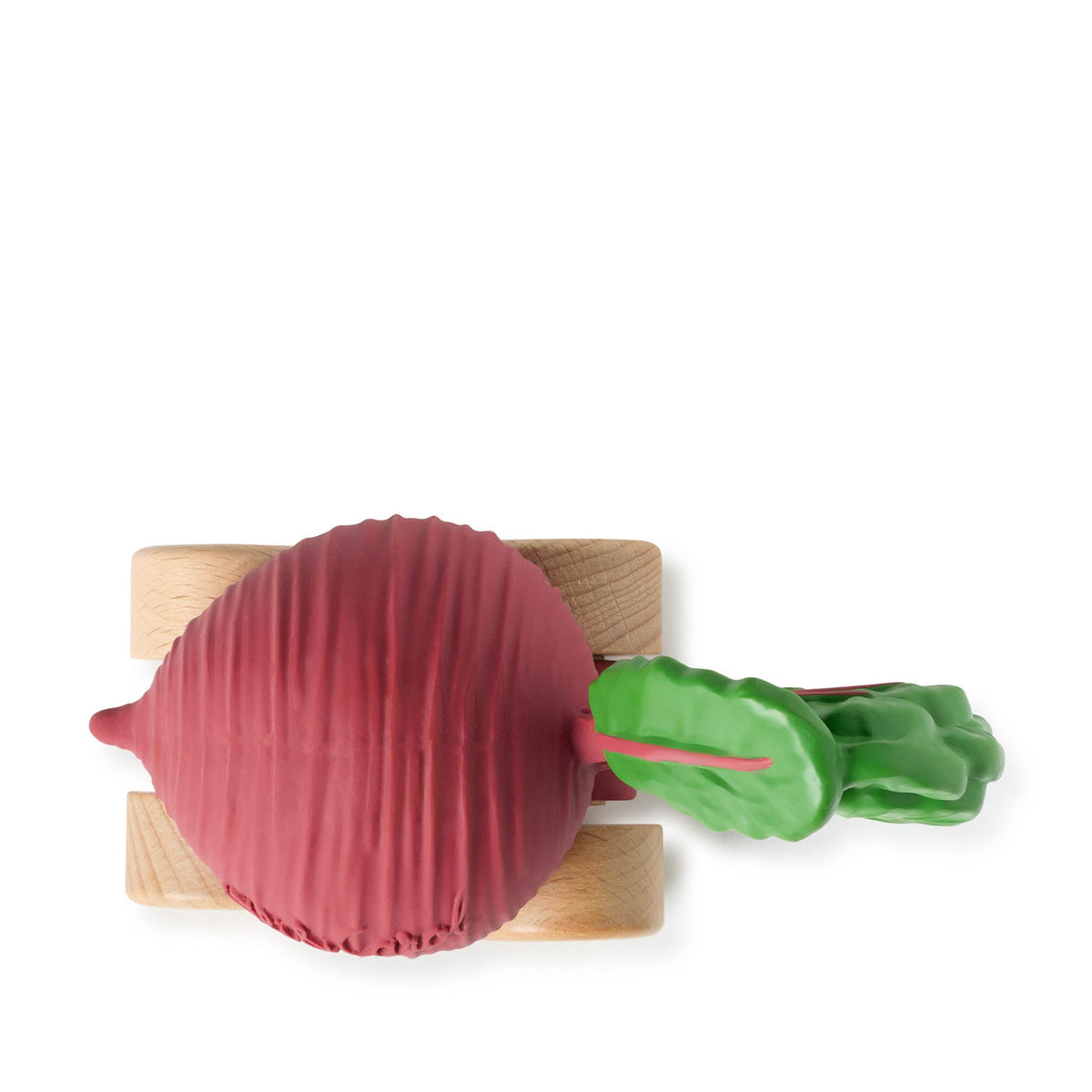 Red beetroot with a green leaf on a wooden cutting board against a white background