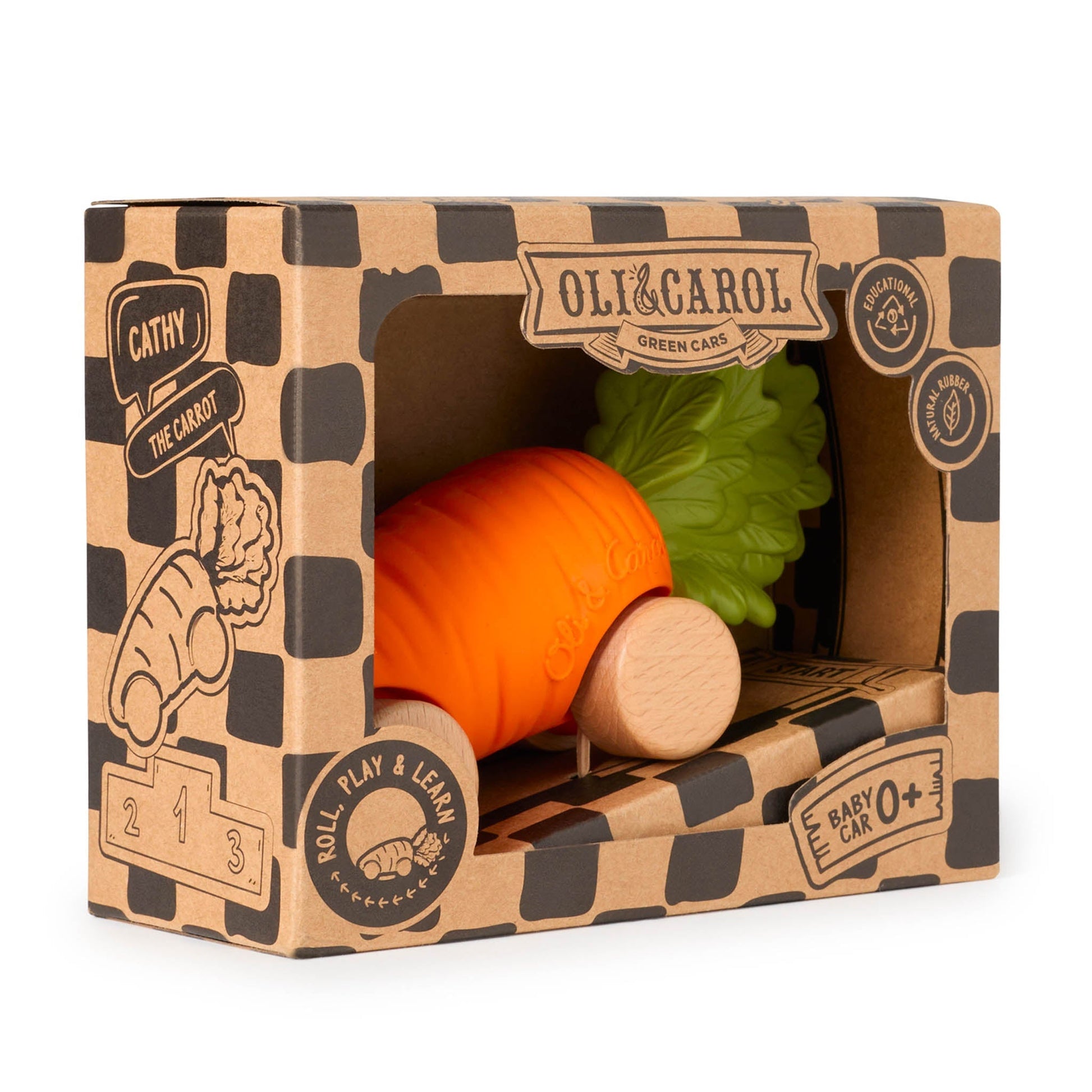 Toy carrot and baby car in a cardboard box with 'Oli & Carol' branding.