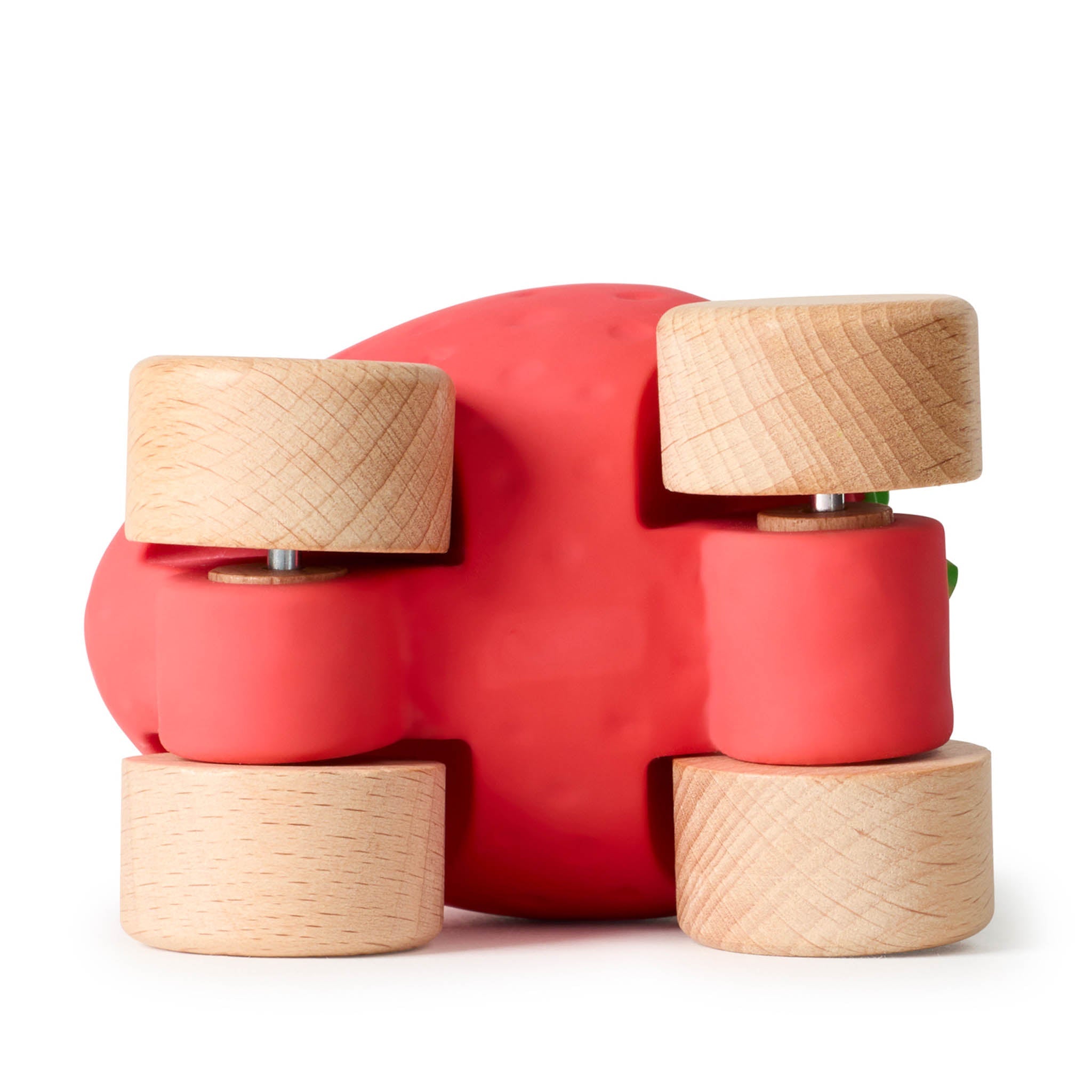Red toy with wooden wheels on a white background