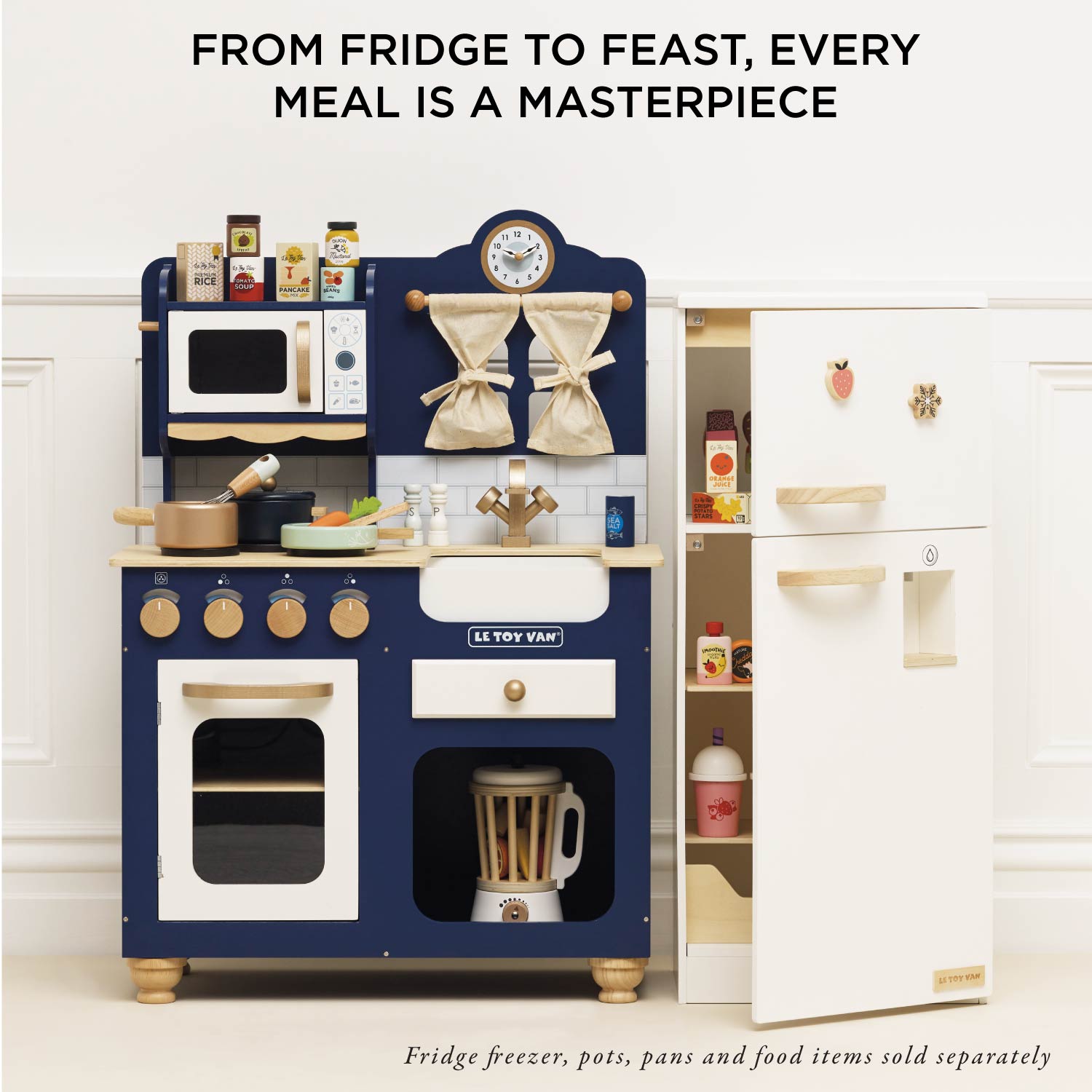 Children's play kitchen set with a refrigerator and various appliances on a white background.