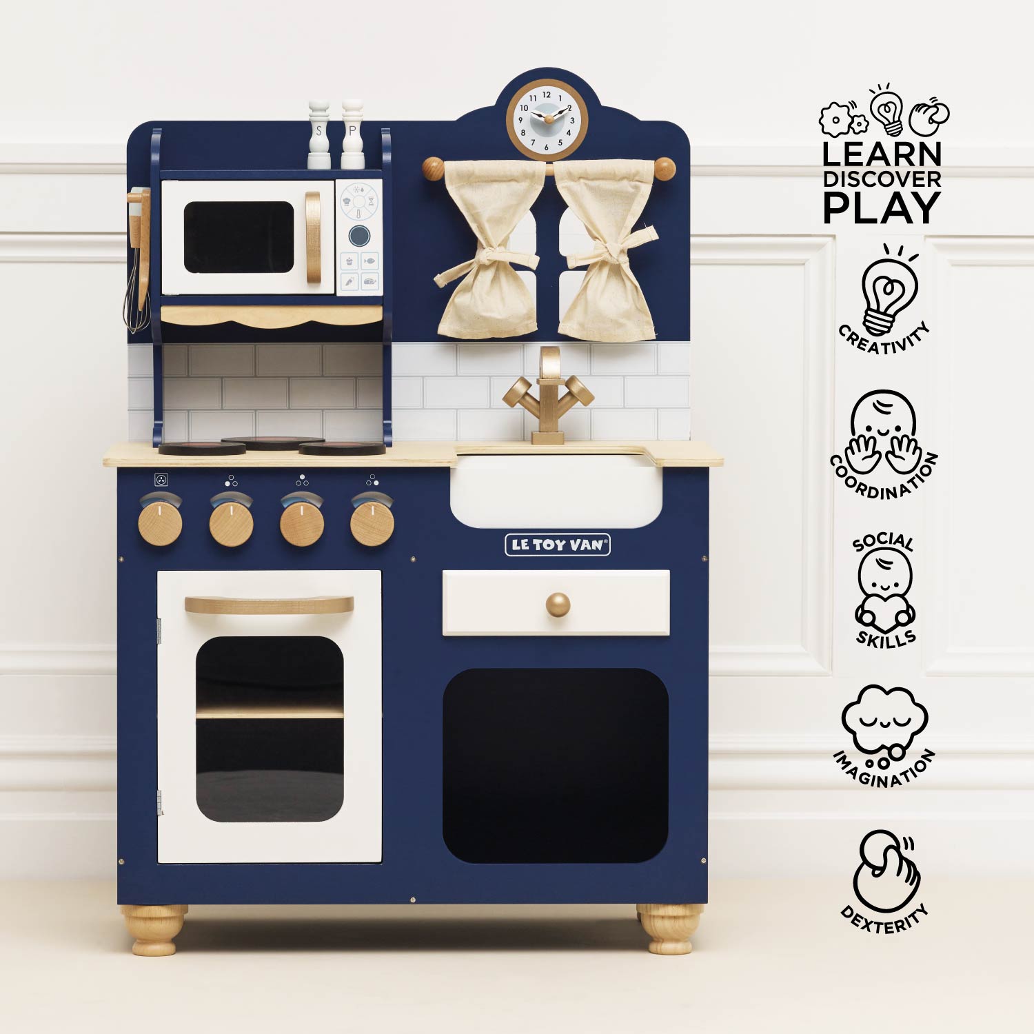 Children's toy kitchen set with blue and white design on a light background