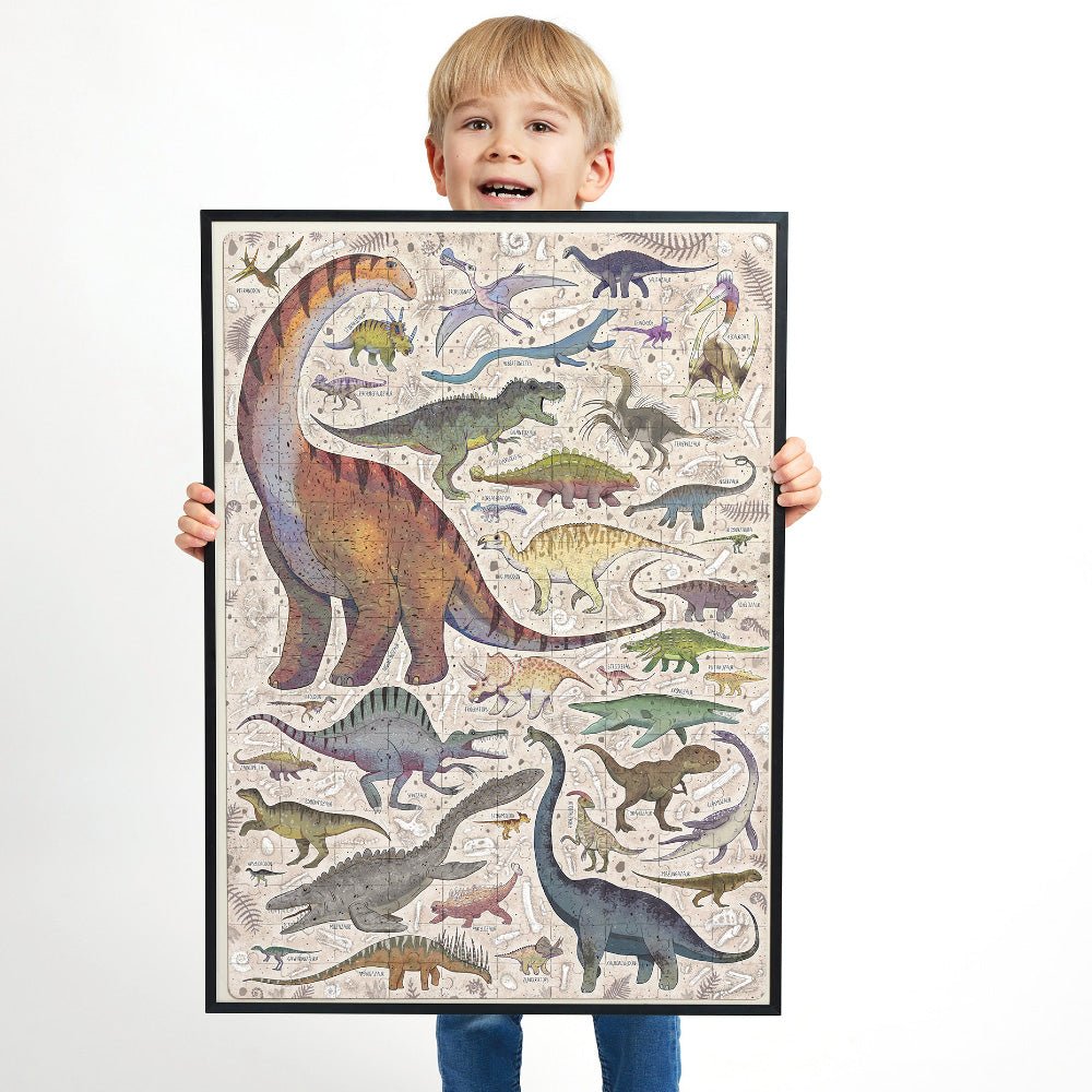Child holding a framed poster of colorful dinosaur illustrations