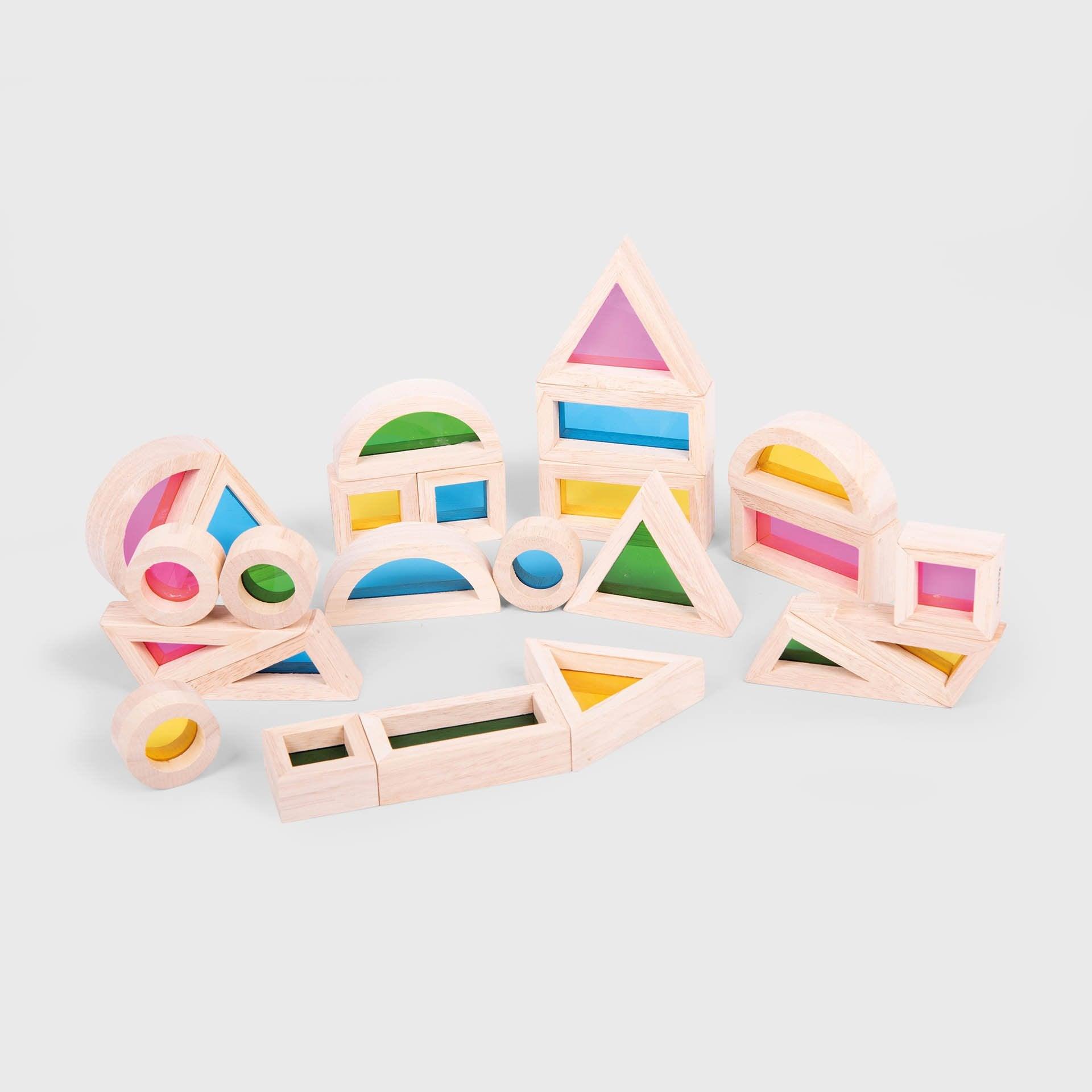 Set of colorful wooden shape blocks on a light gray background