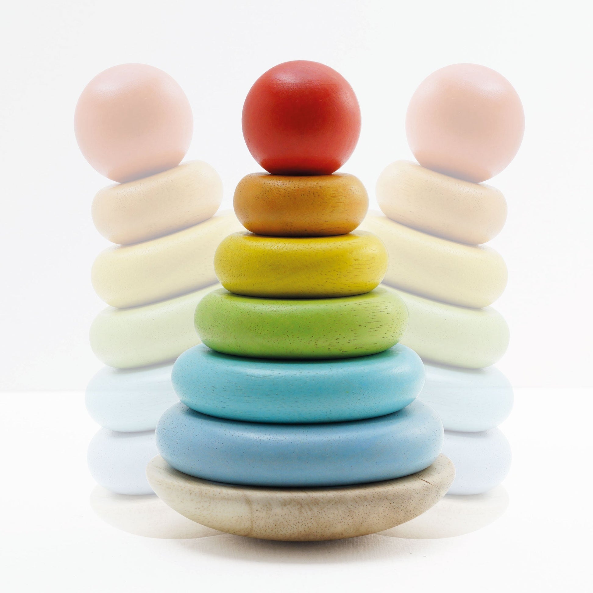 Colorful wooden stacking rings on a white background