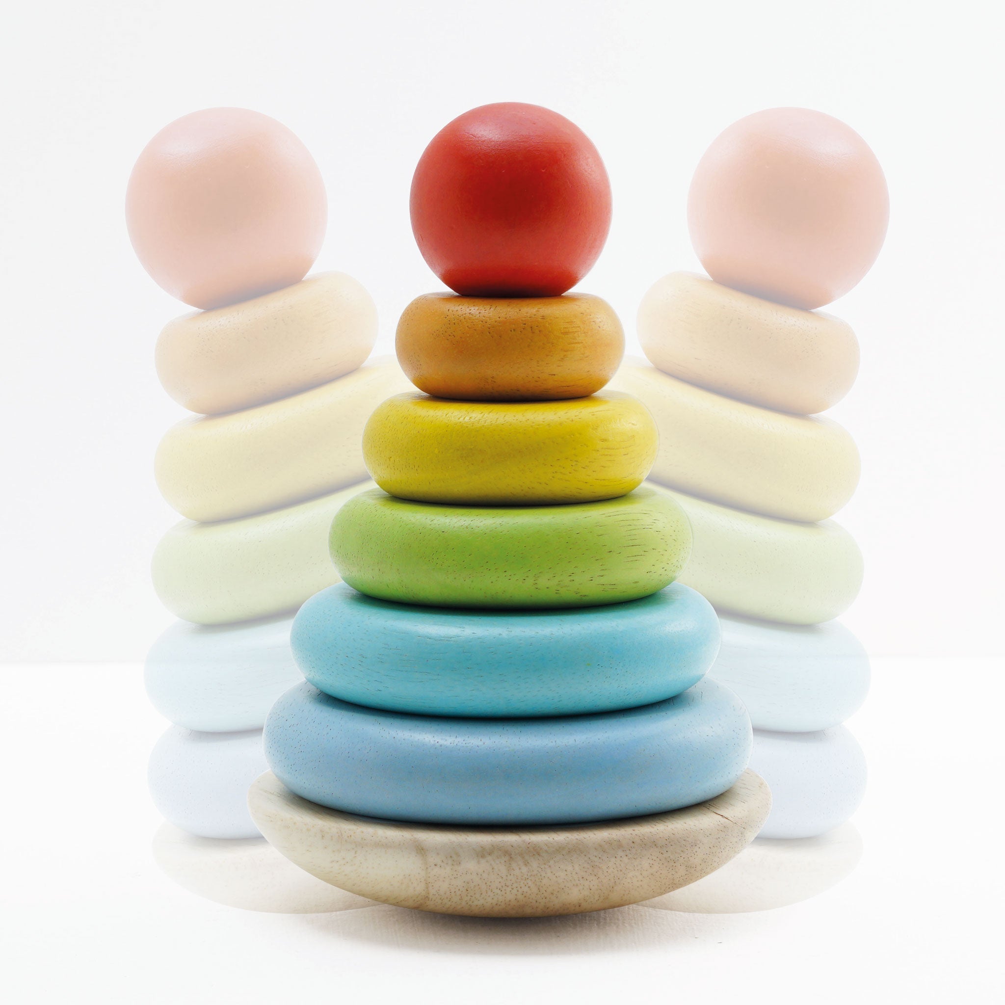 Colorful wooden stacking rings on a white background