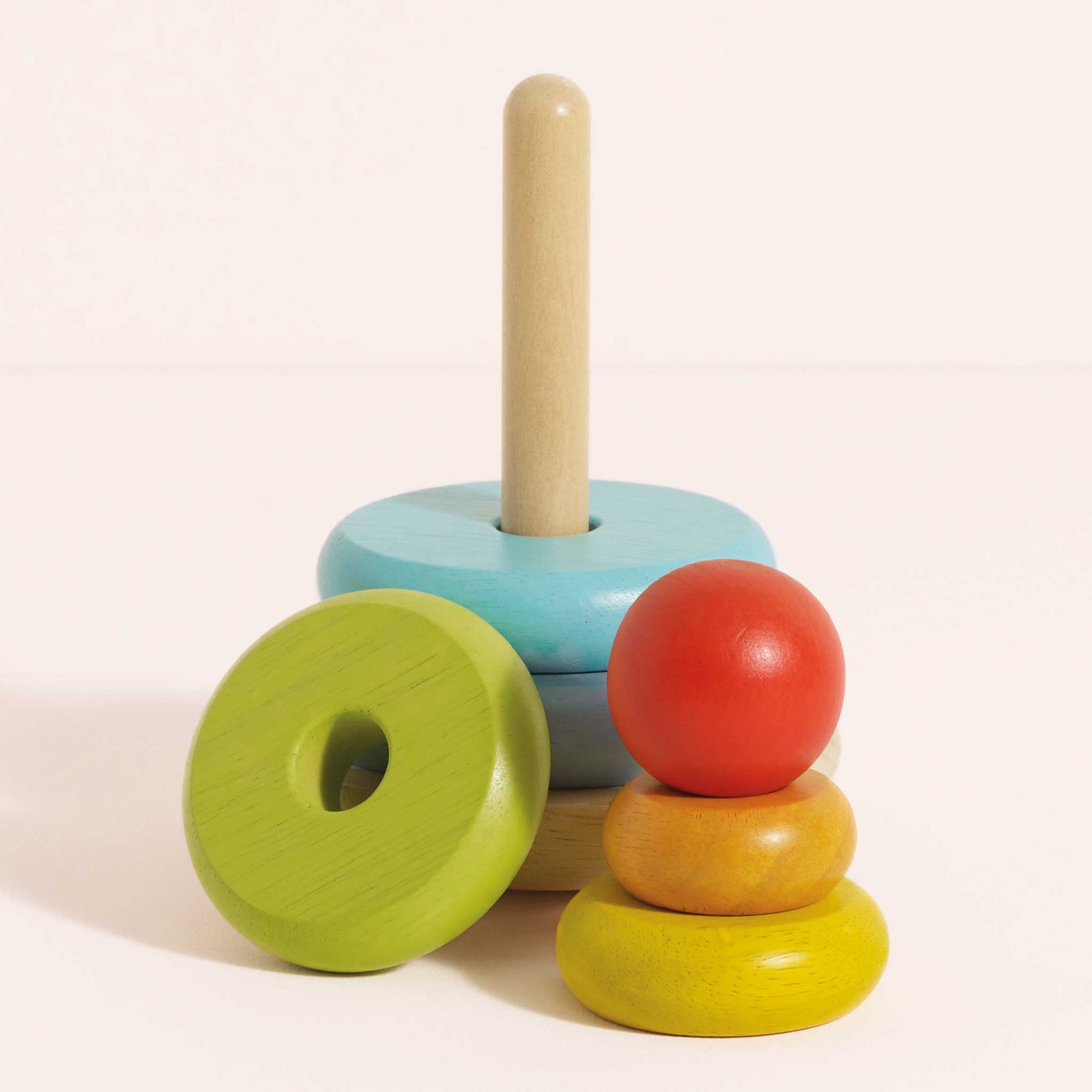Colorful wooden stacking toy on a light background