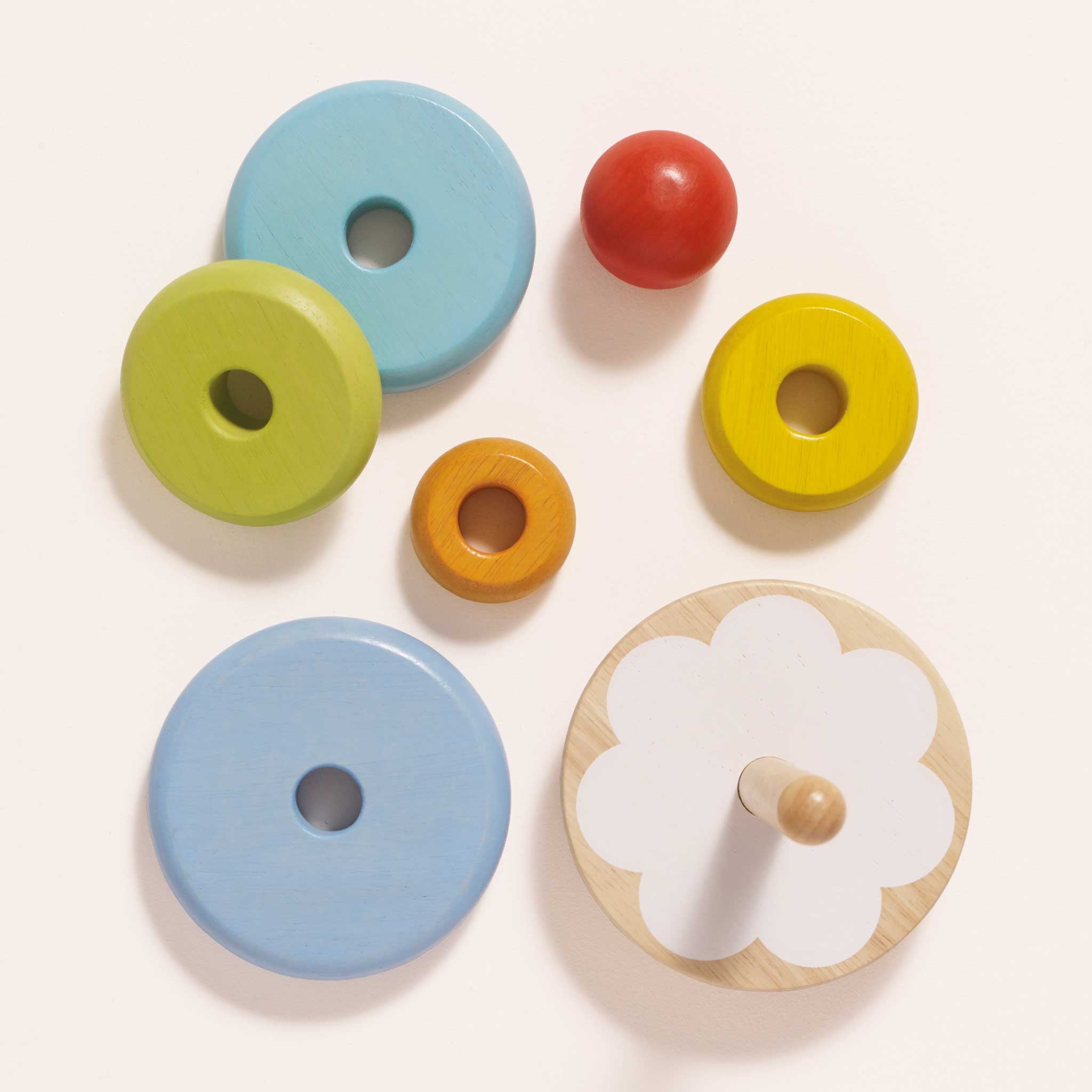 Colorful wooden toys on a white background