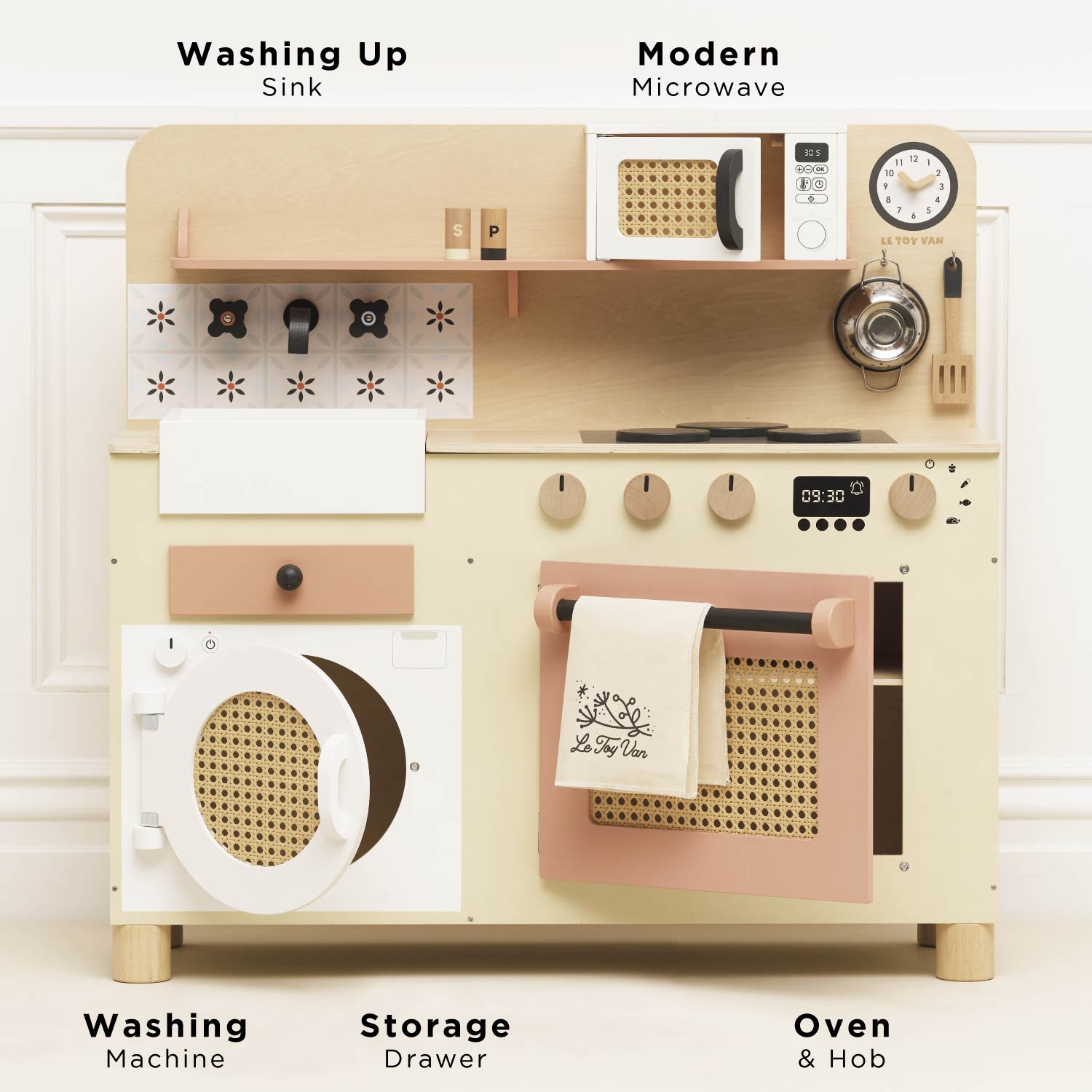 Wooden play kitchen set with toy appliances on a white background