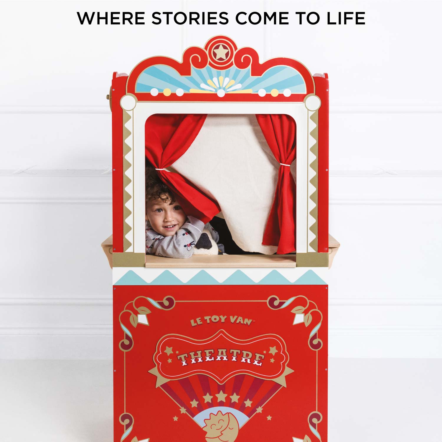 Red puppet theatre with a child's face peering out, on a white background with text 'WHERE STORIES COME TO LIFE'.