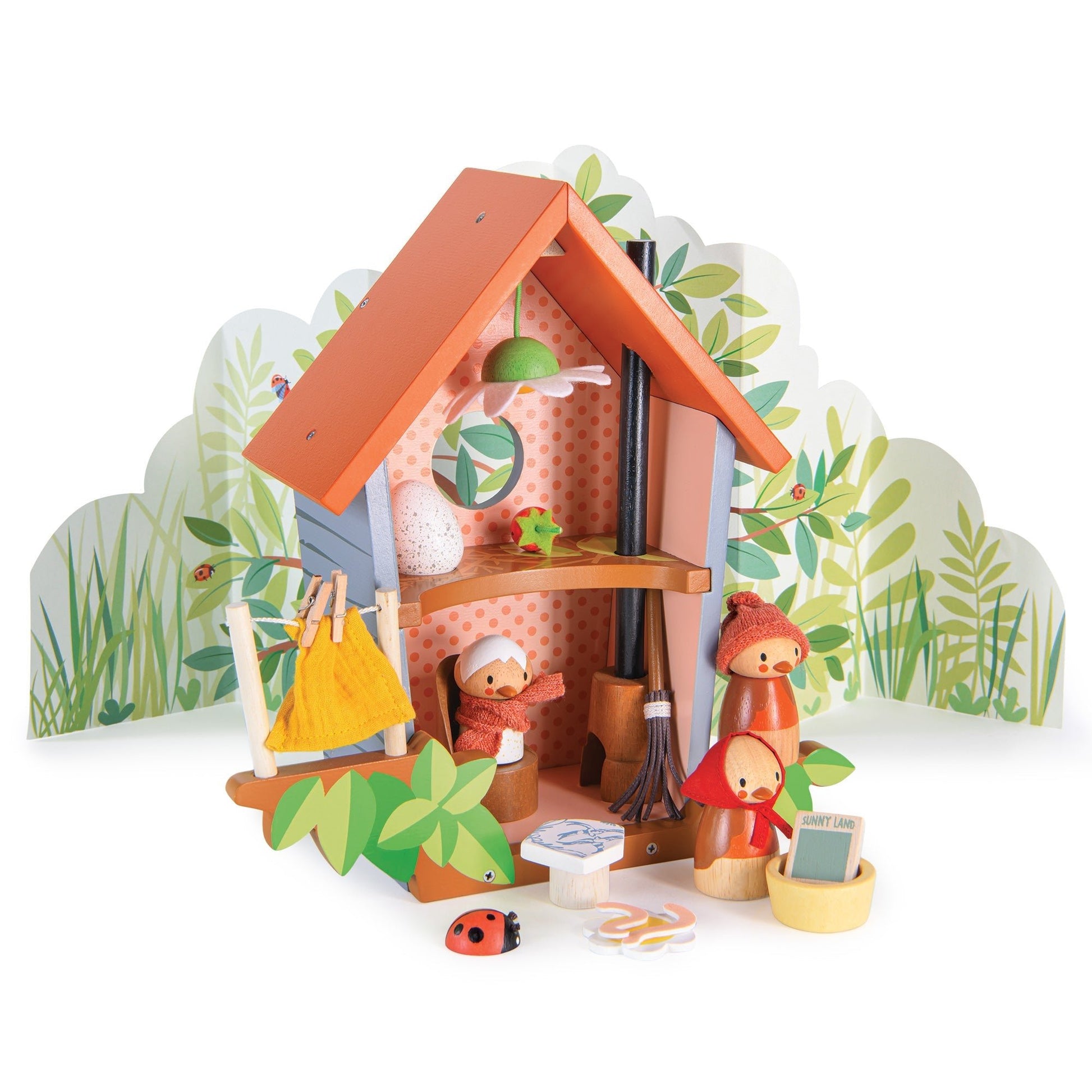 Toy playset with a small house, characters, and accessories on a white background