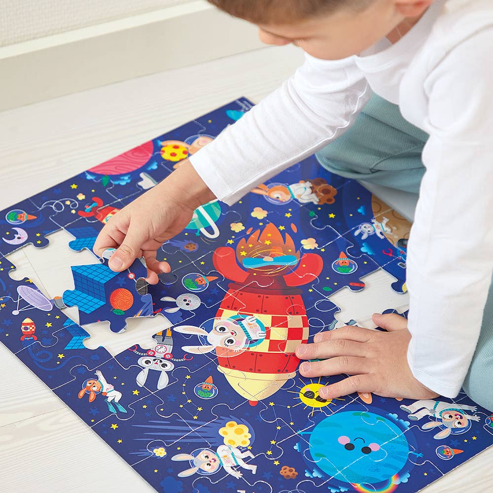 Child playing with a colorful puzzle on a mat