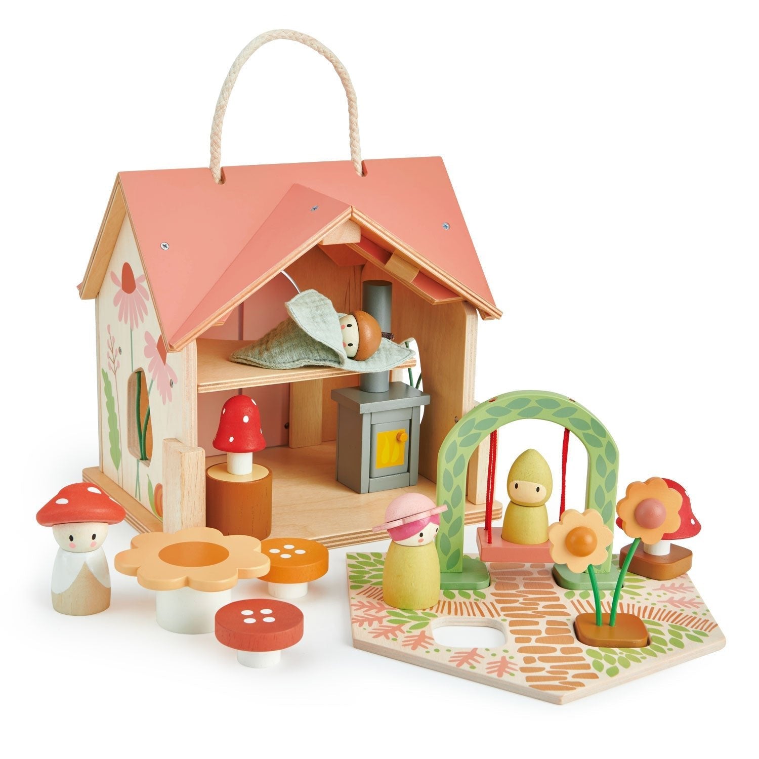 Wooden toy house with accessories on a white background