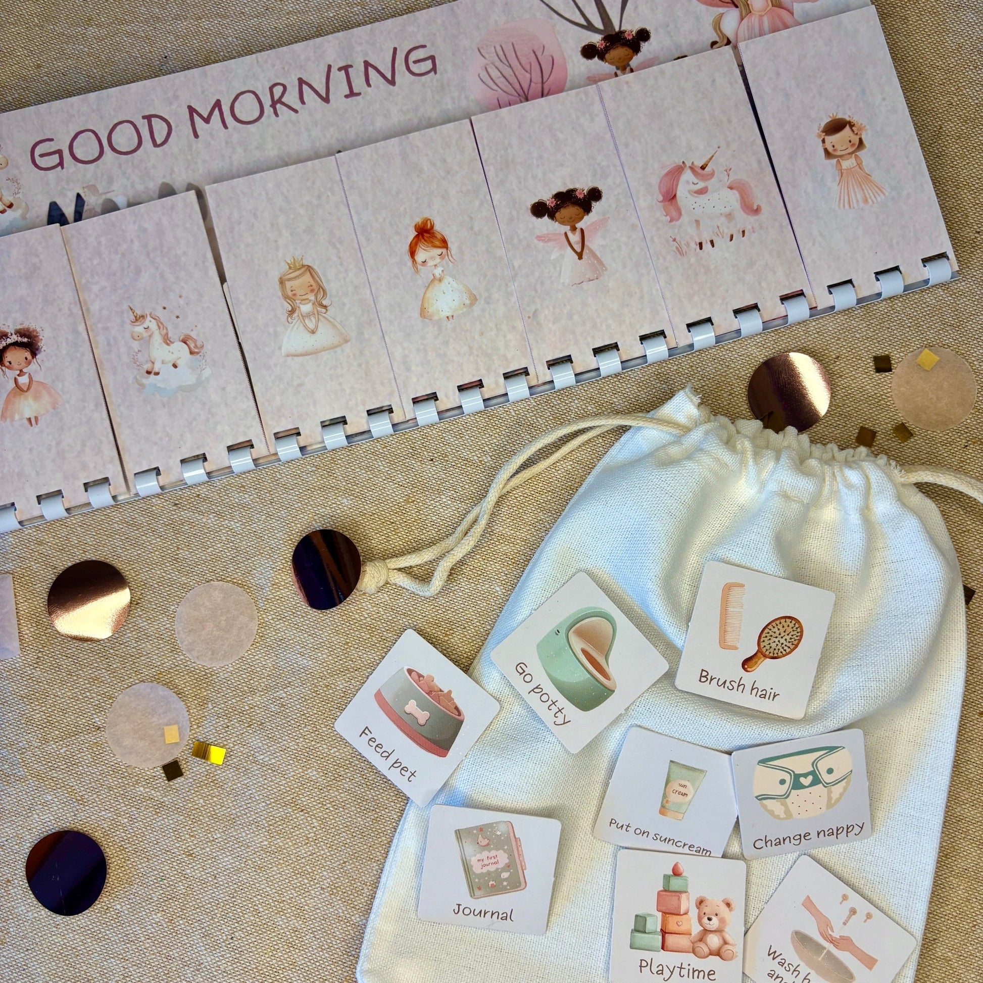 Educational cards with illustrations and a drawstring bag on a textured surface