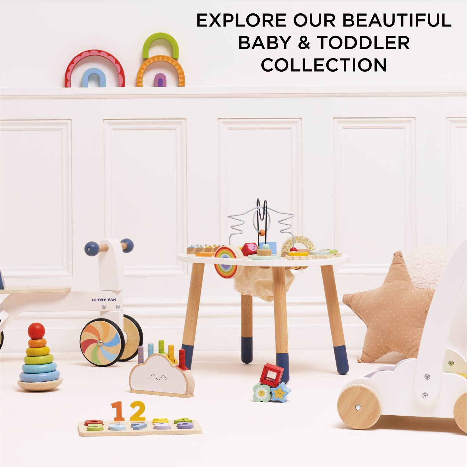 Children's toys and furniture in a room with text promoting a baby and toddler collection.