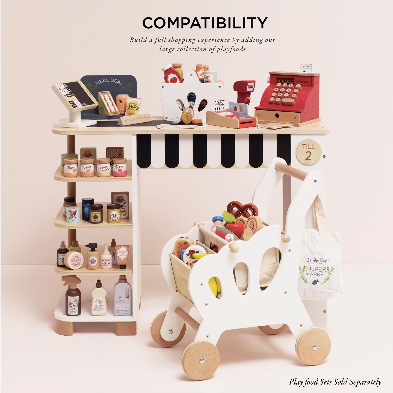 Toy supermarket set with various toy items on a white background