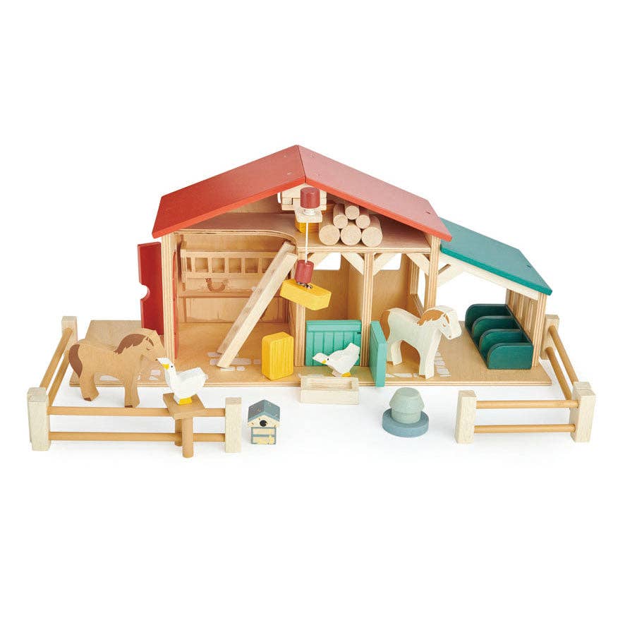 Wooden toy farm set with barn, animals, and accessories on a white background