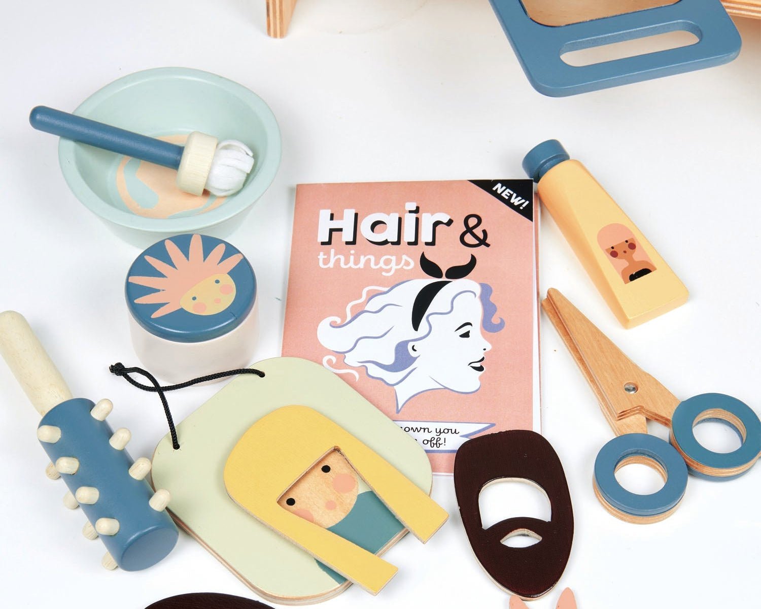 Collection of wooden hair styling toys and accessories on a white surface.