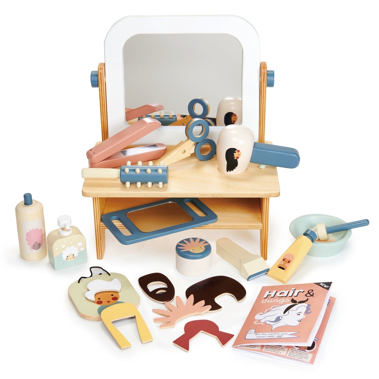 Wooden toy hair salon set with various tools and accessories on a white background