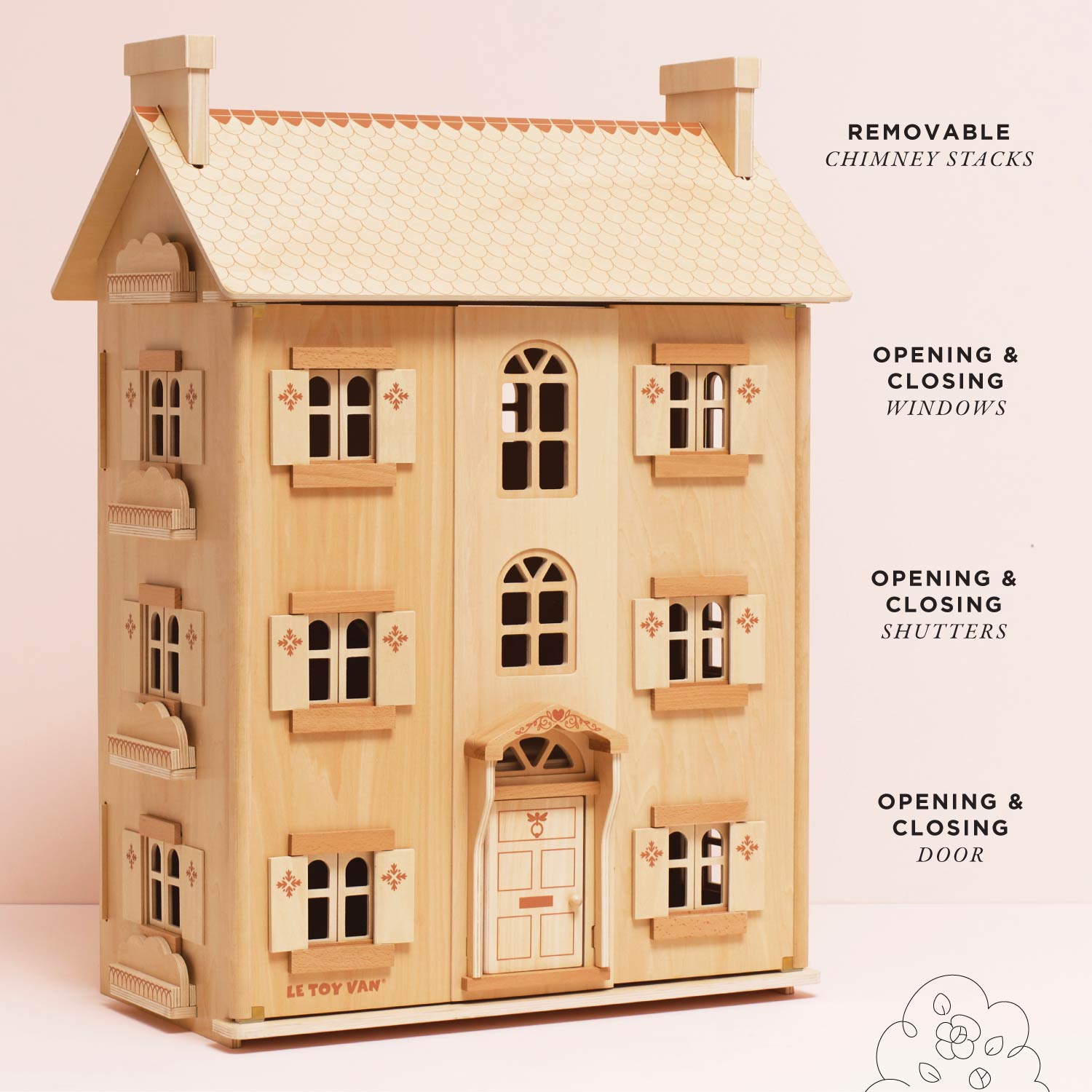 Wooden dollhouse with movable elements on a light pink background