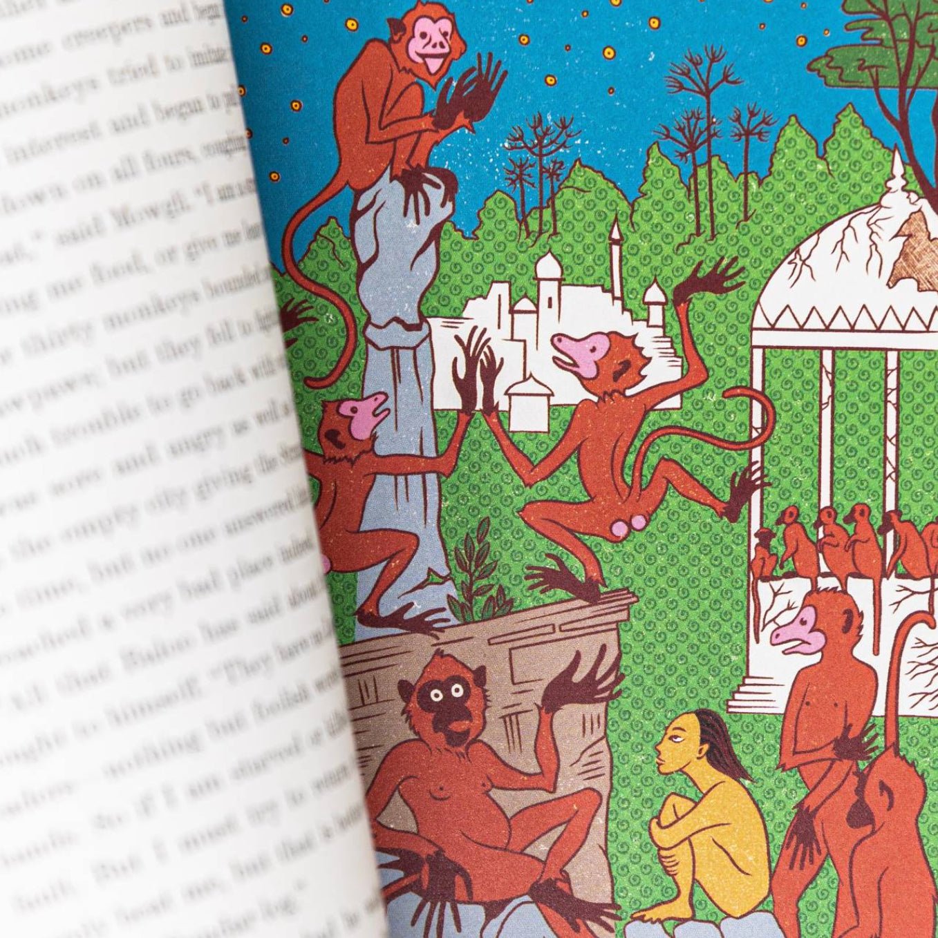 Illustration of monkeys and a human figure in a garden setting on a book page.