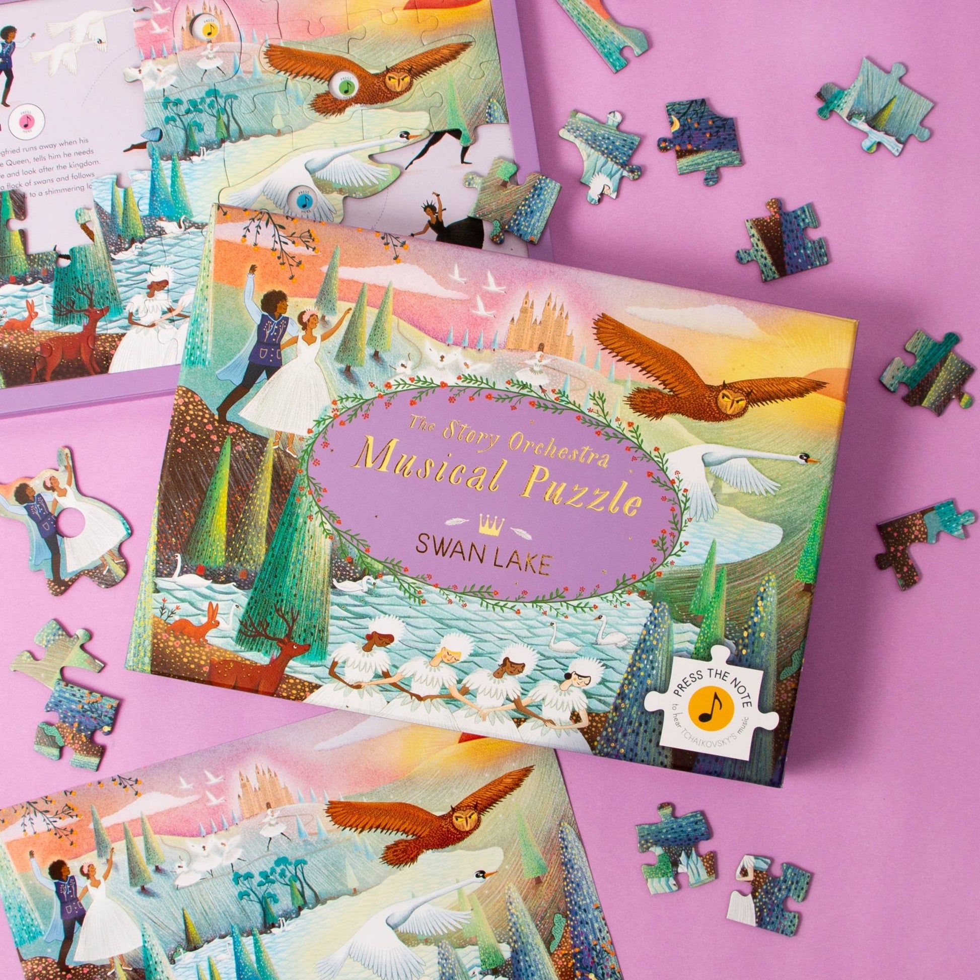 Swan Lake musical puzzle set with pieces on a pink background