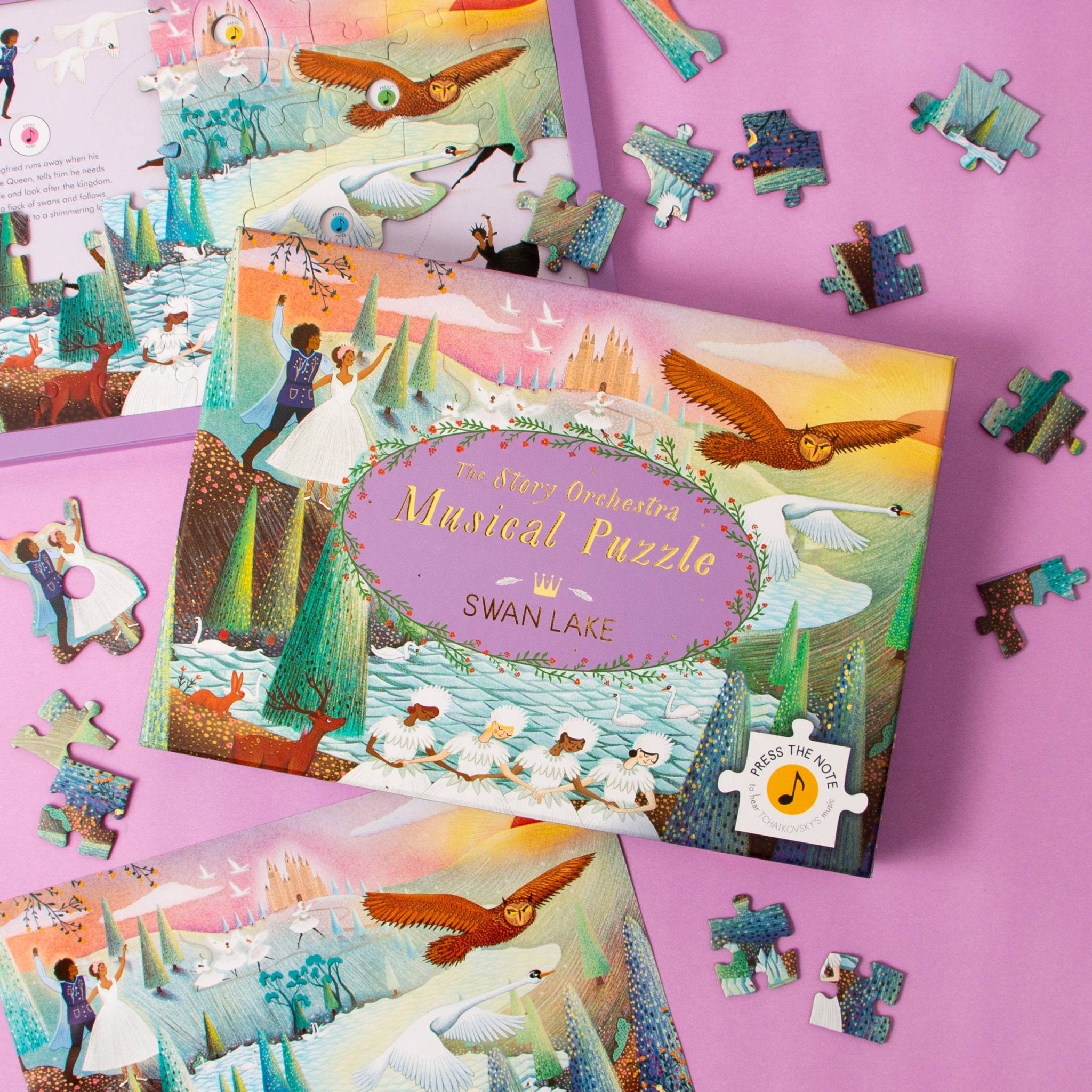 Swan Lake musical puzzle set with pieces on a pink background