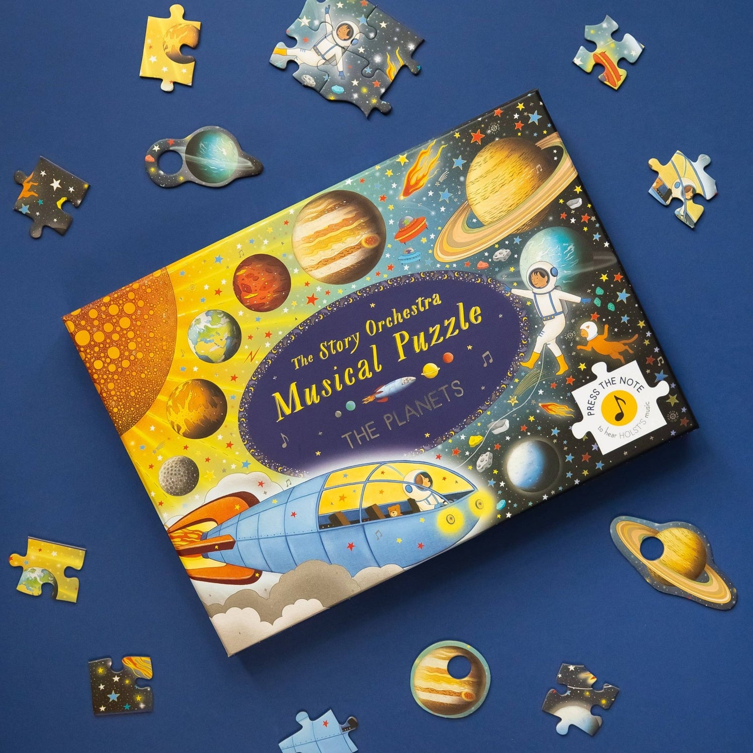 Children's puzzle set with space-themed design on a blue background