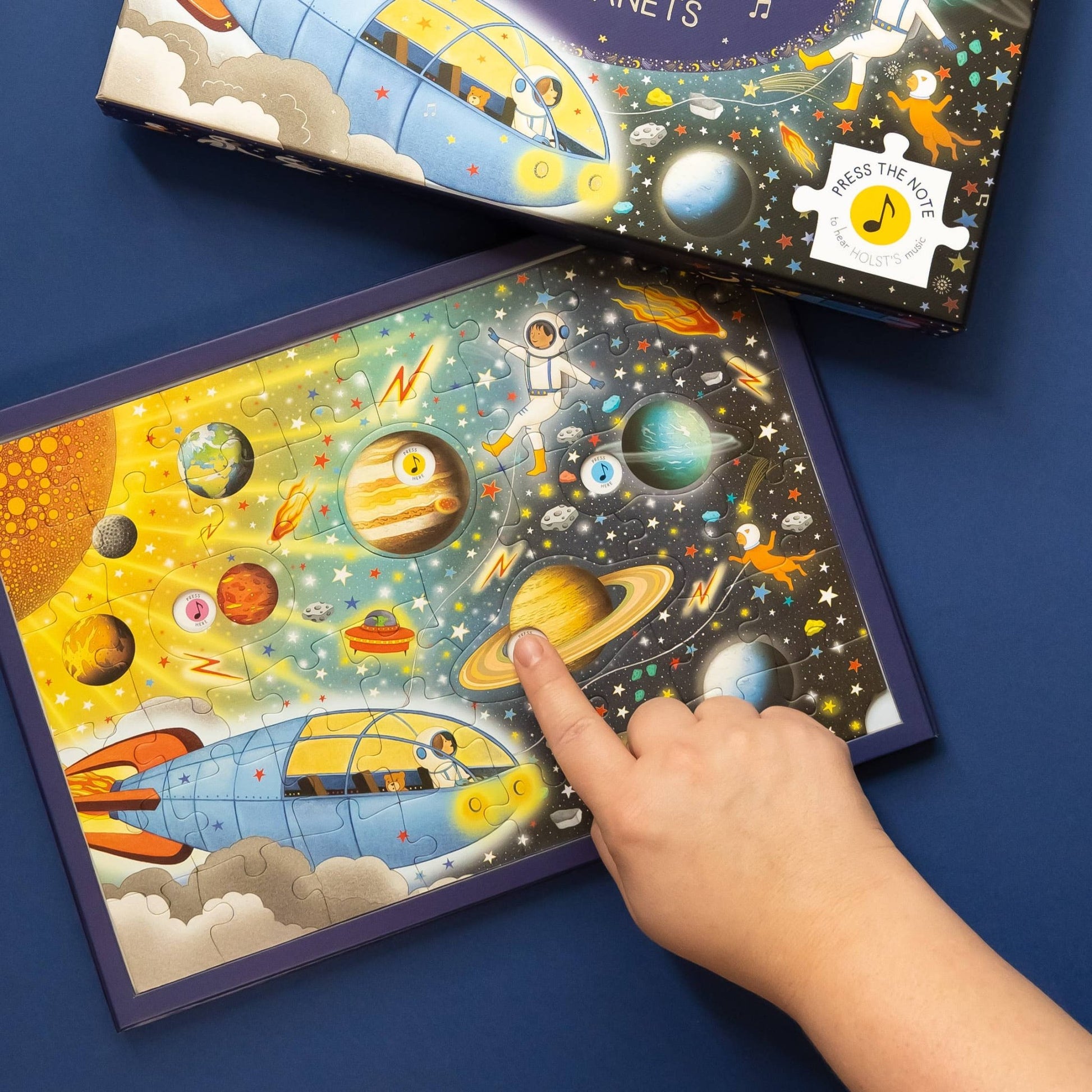 Children's puzzle with space theme on a blue background