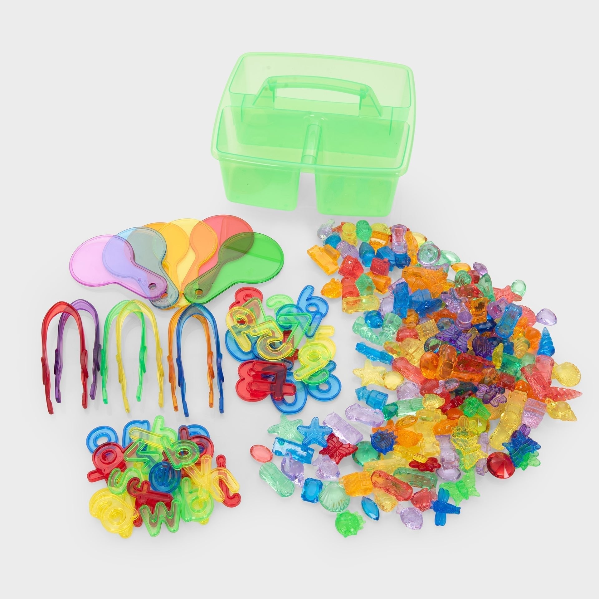 Colorful plastic beads and tools on a white background with a green storage box.