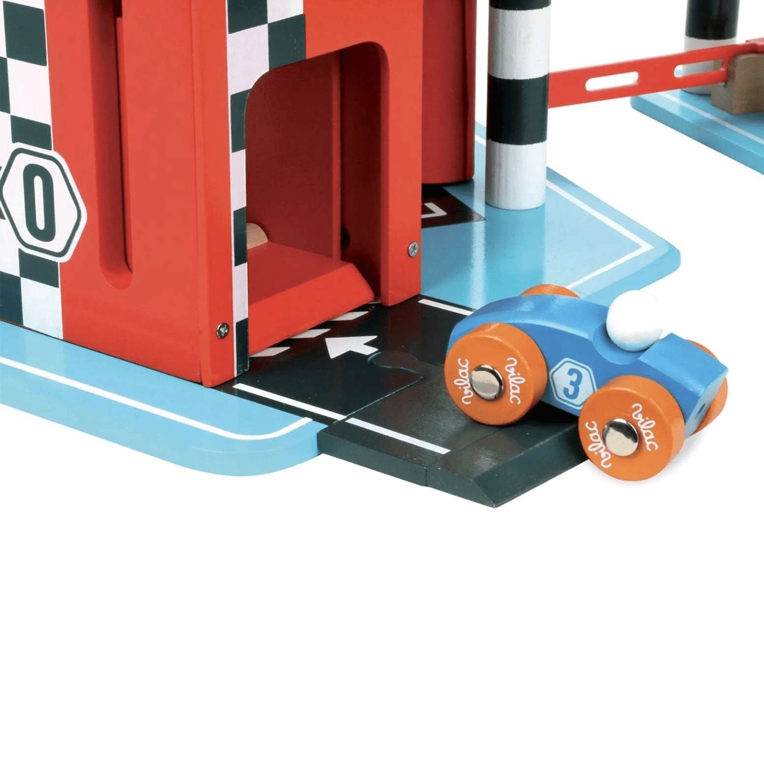 Toy race car on a track with a red starting gate and checkered flag.