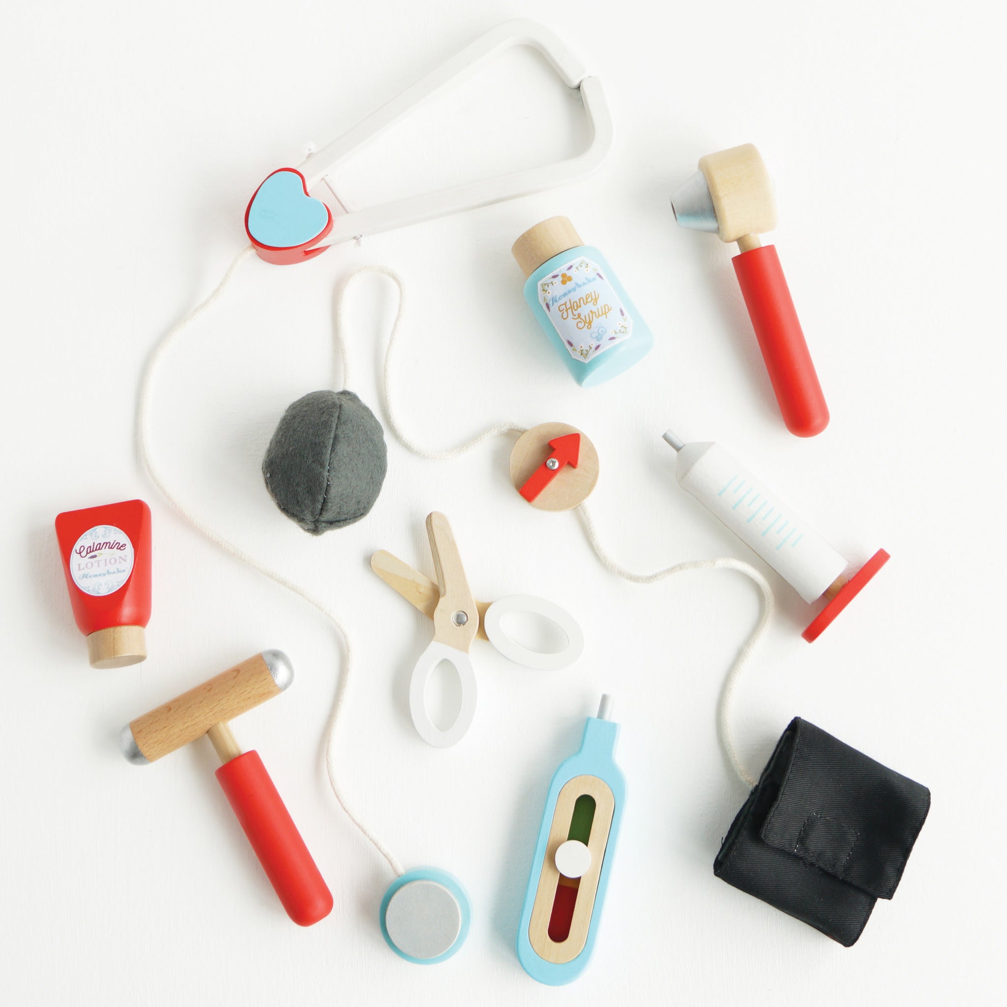 Set of colorful wooden toys on a white background