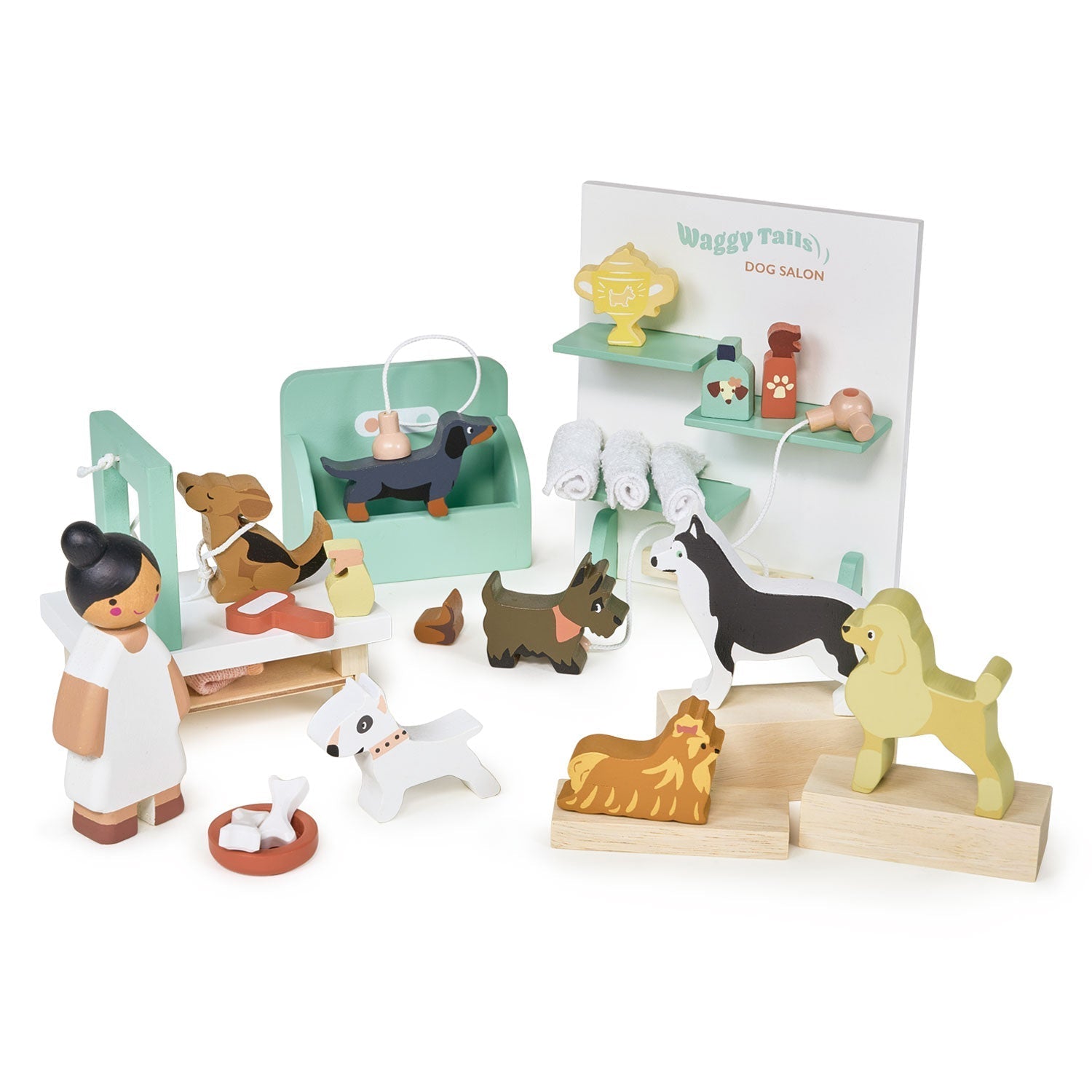 Wooden toy set with dogs and a vet, including a 'Dog Salon' sign, on a white background.