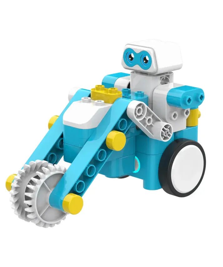 Toy robot with blue and white body, yellow accents, and black wheels on a white background