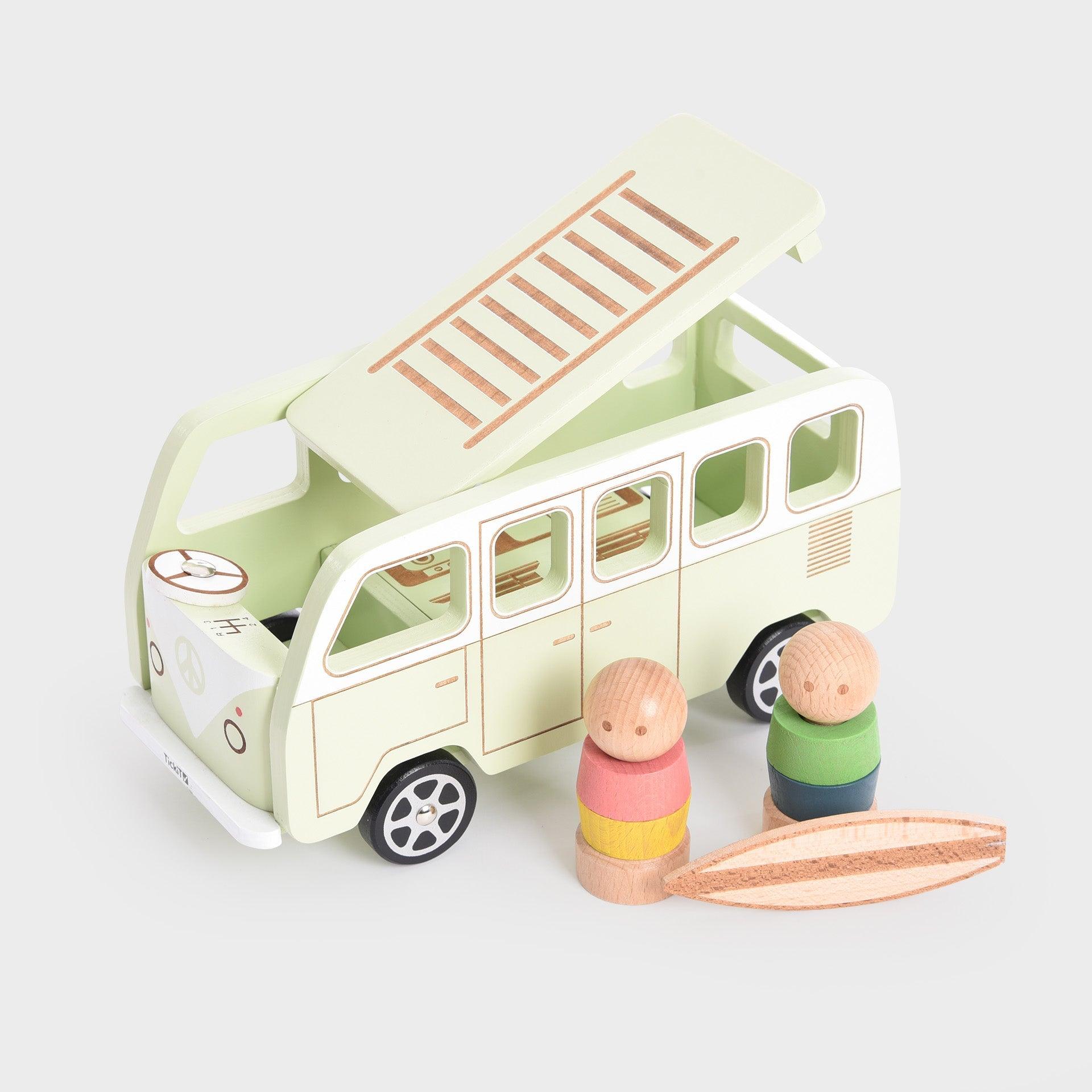 Toy van with two figures and a surfboard on a light gray background