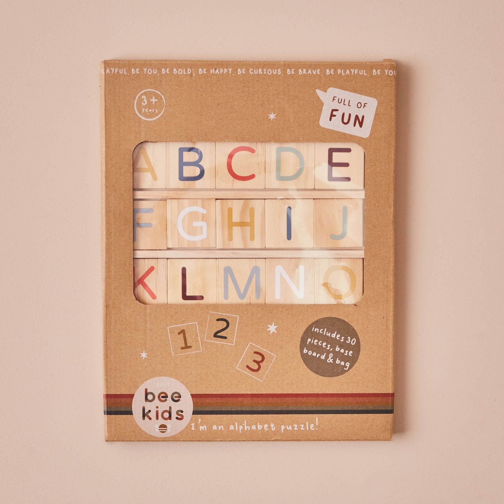 Alphabet and number puzzle set in a brown cardboard box with 'bee kids' branding on a beige background.
