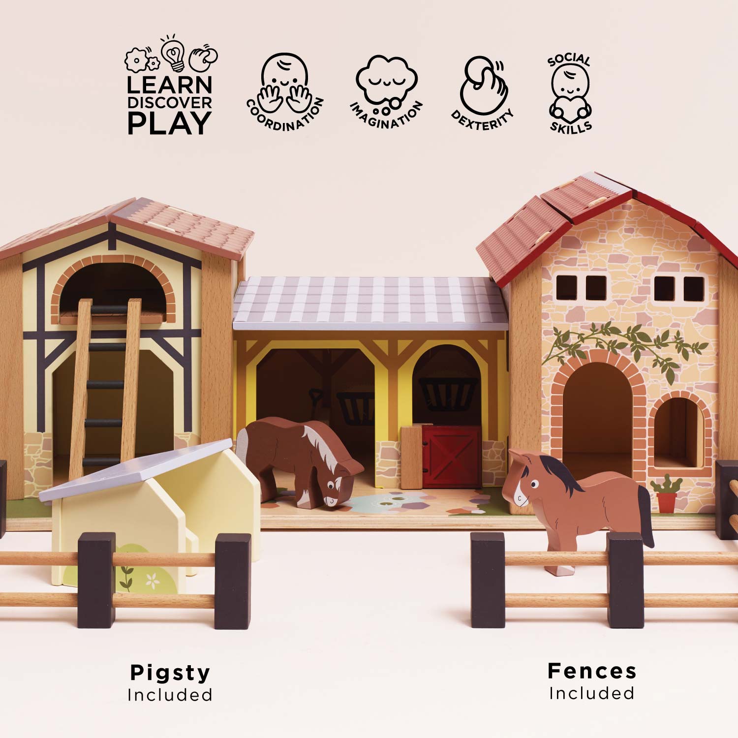 Toy stable set with animals and accessories on a light background