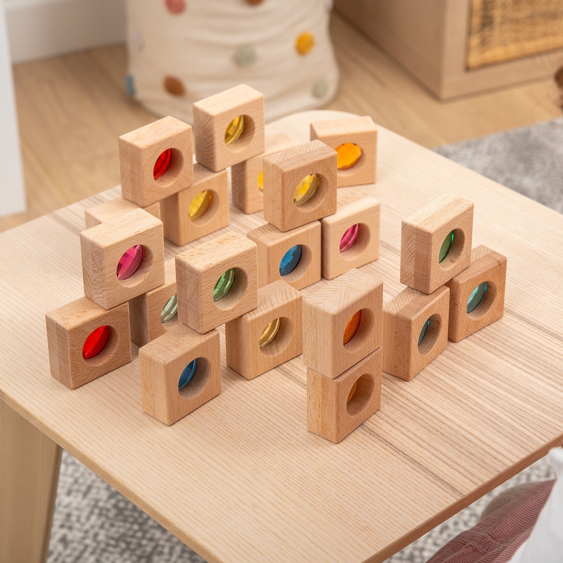 Wooden blocks with colored circles on a wooden table
