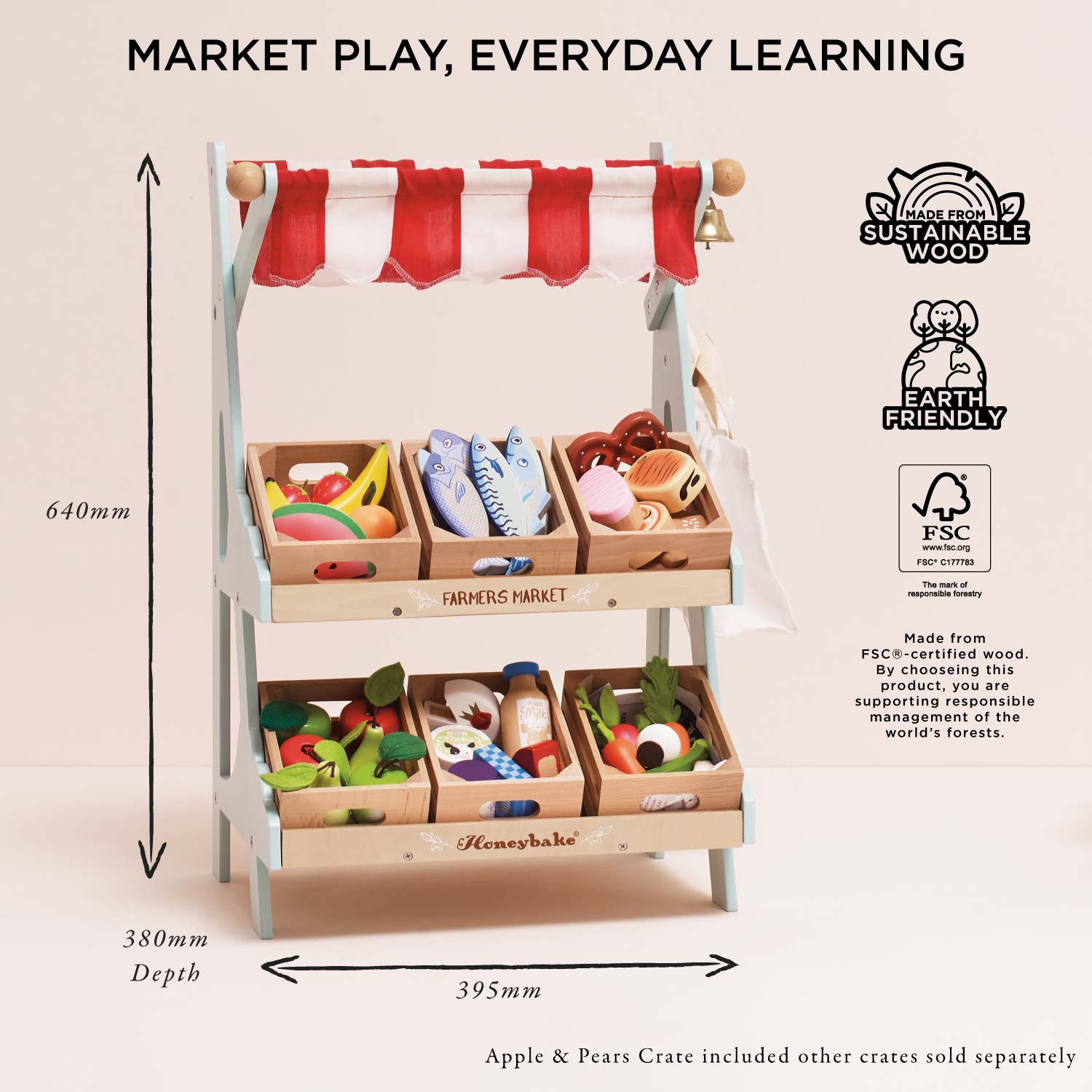 Wooden toy market set with red and white striped canopy, dimensions, and sustainability logos displayed.
