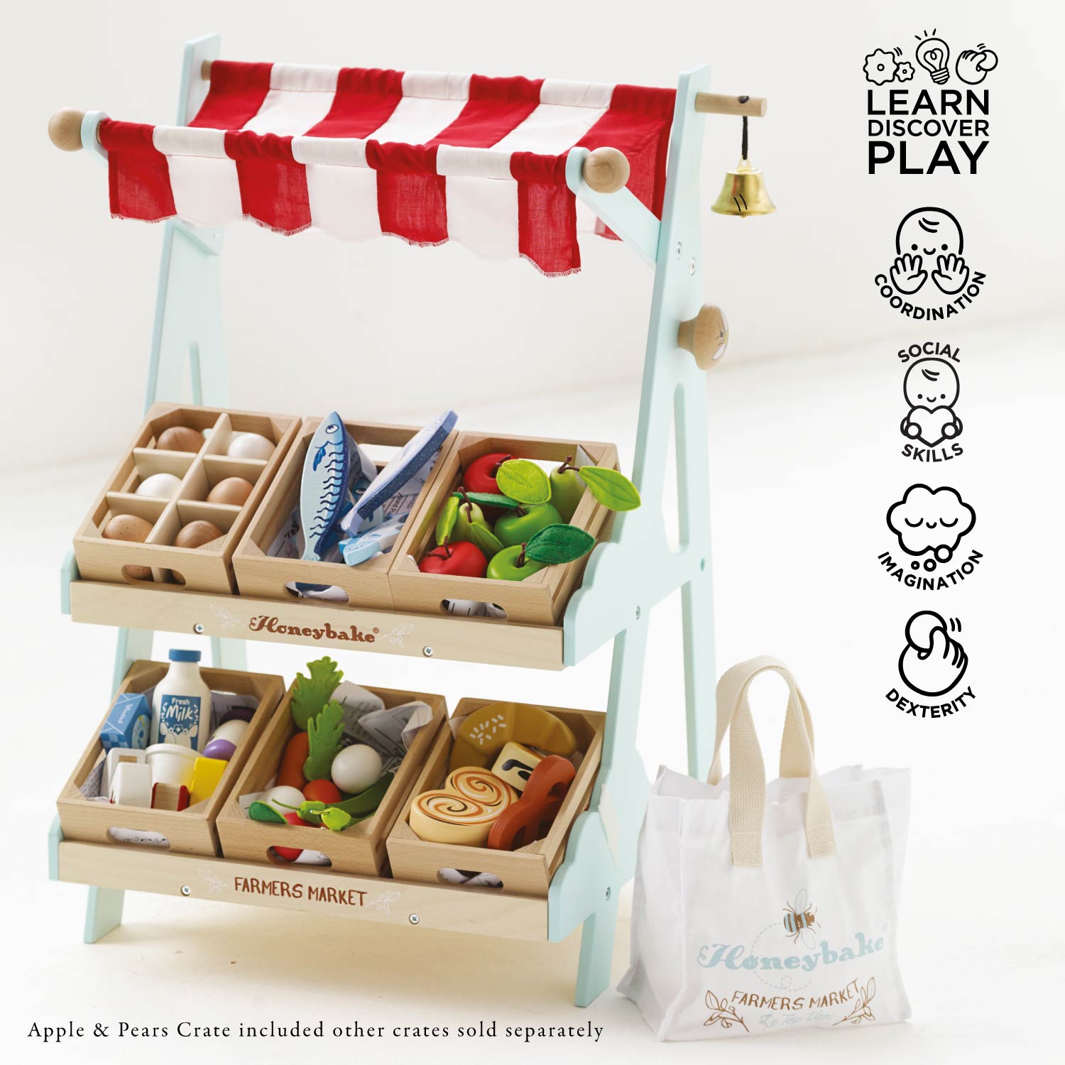 Toy farmers market with wooden crates and food items, featuring the Honeybake brand.