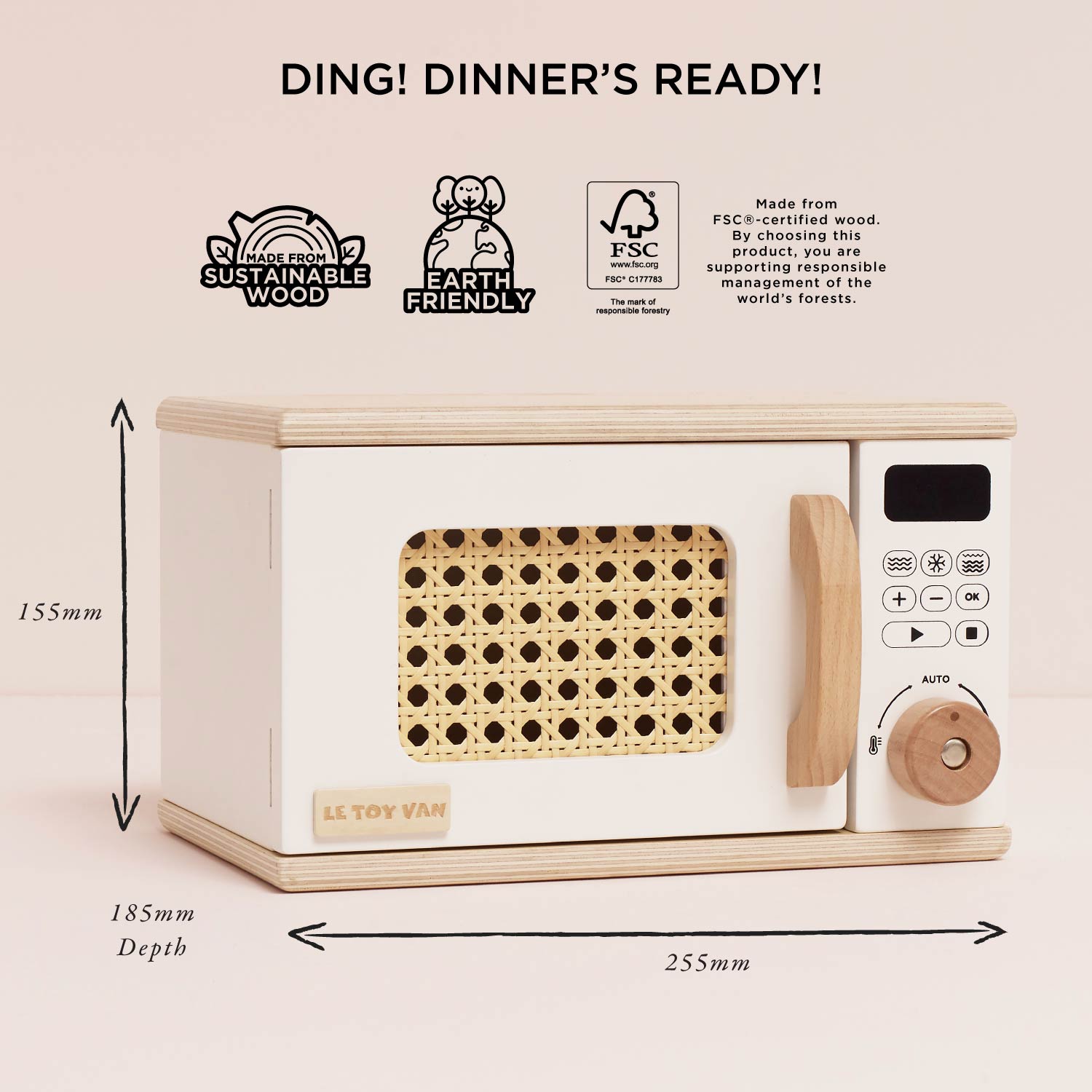 Wooden toy microwave with dimensions and sustainability labels on a beige background