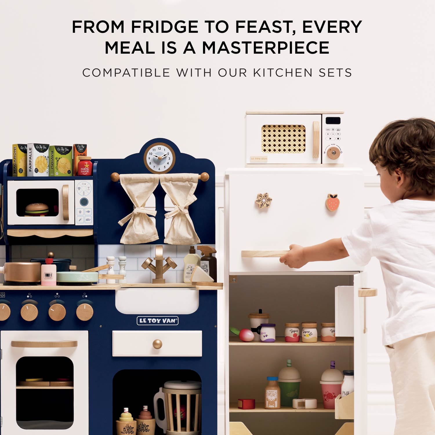 Children's play kitchen set with a child interacting with it, featuring text about meal preparation.