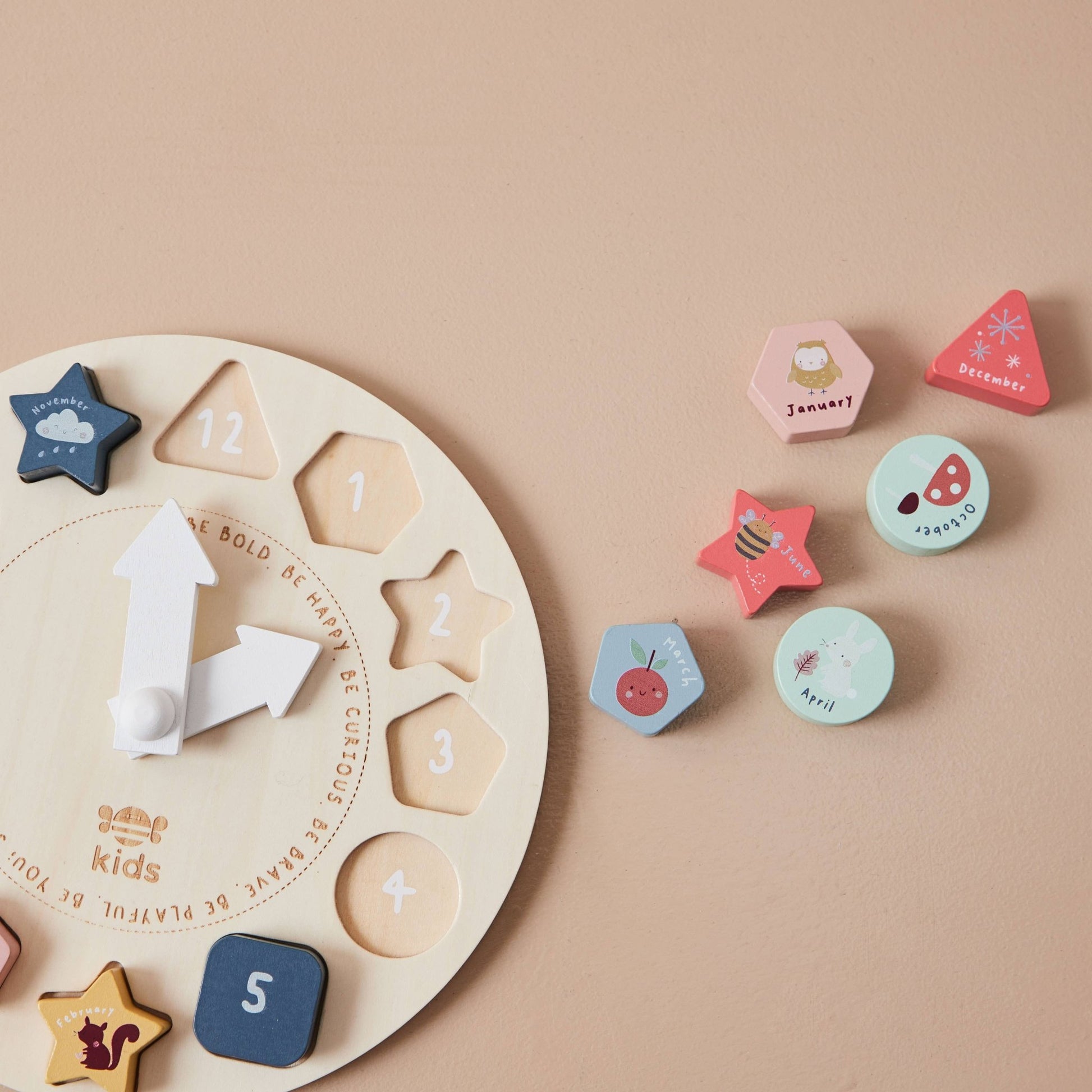 Wooden educational toy with shapes and numbers on a beige background