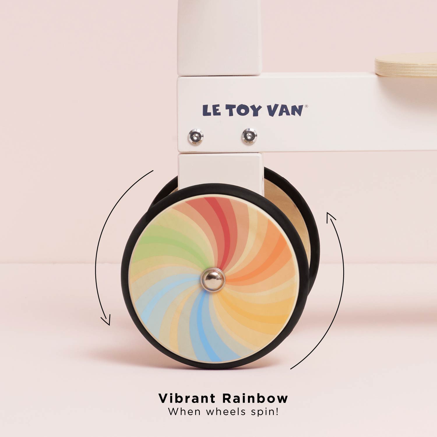 LE TOY VAN toy with a colorful wheel on a pink background
