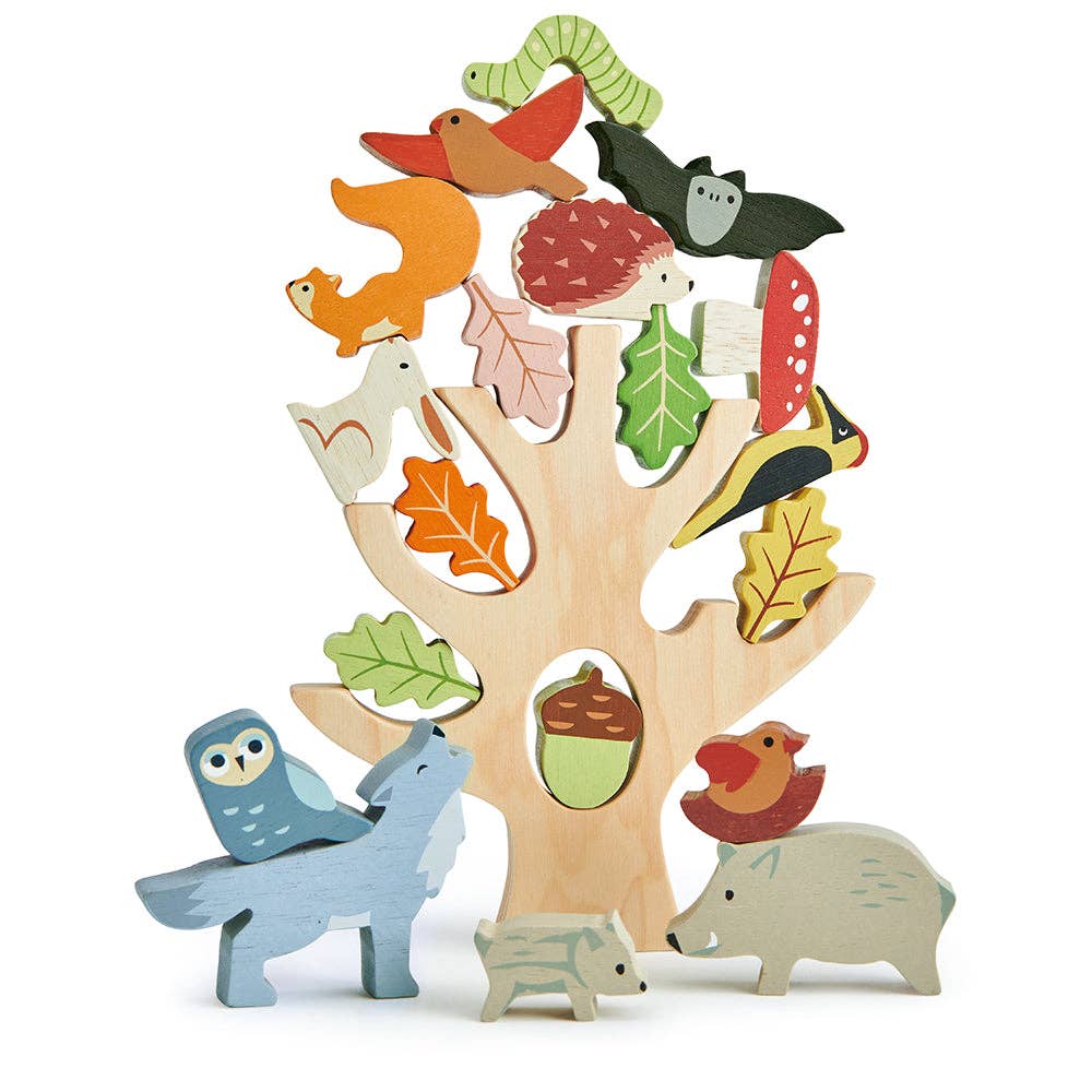 Wooden toy tree with animals and nature elements on a white background
