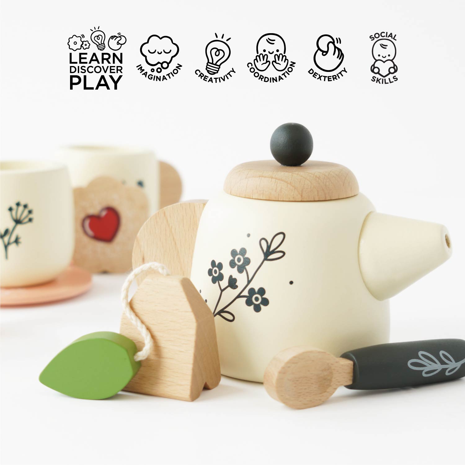 Wooden toy tea set with teapot, cup, and leaf on a white background with educational icons above.